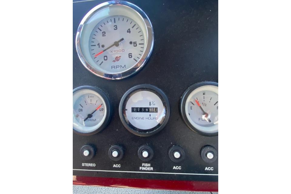 Dashboard of 2023 Spartan 200 Astoria with RPM, trim, engine hours, and fuel gauges.