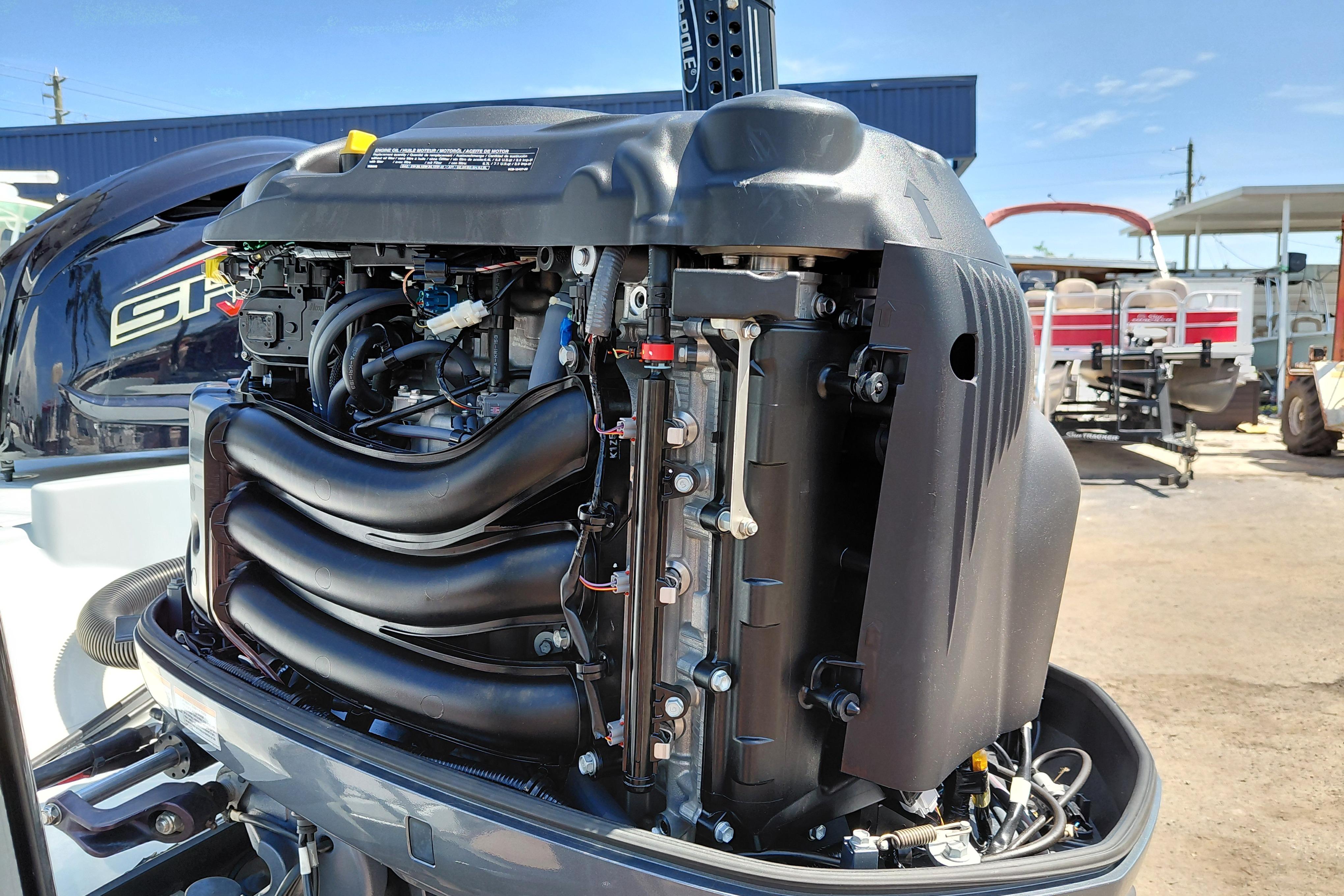 2022 Pathfinder 2300 HPS boat engine, detailed view of internal components, outdoor setting.