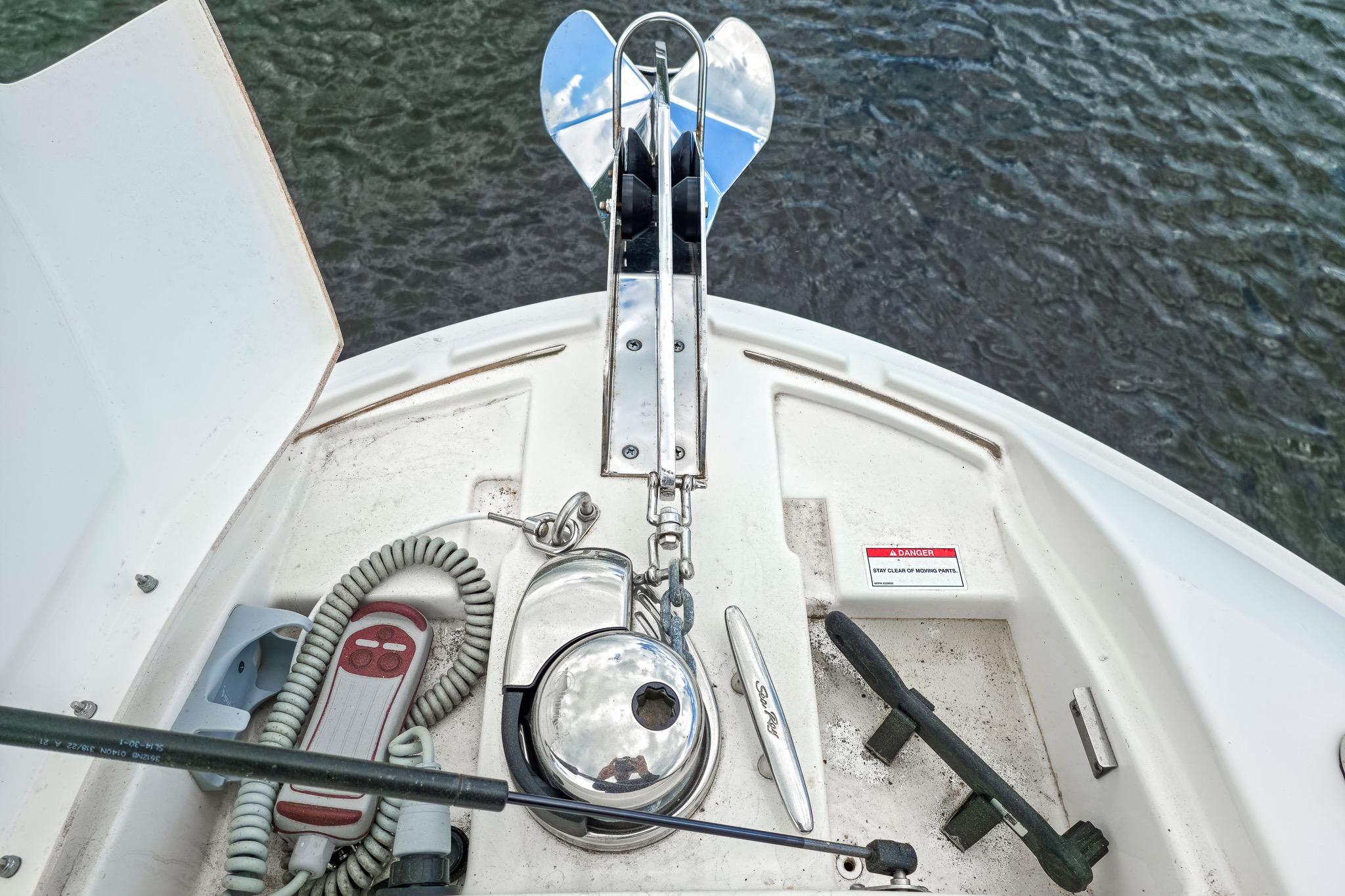 2023 Sea Ray SLX 310 Outboard boat anchor system with control panel and safety warning.