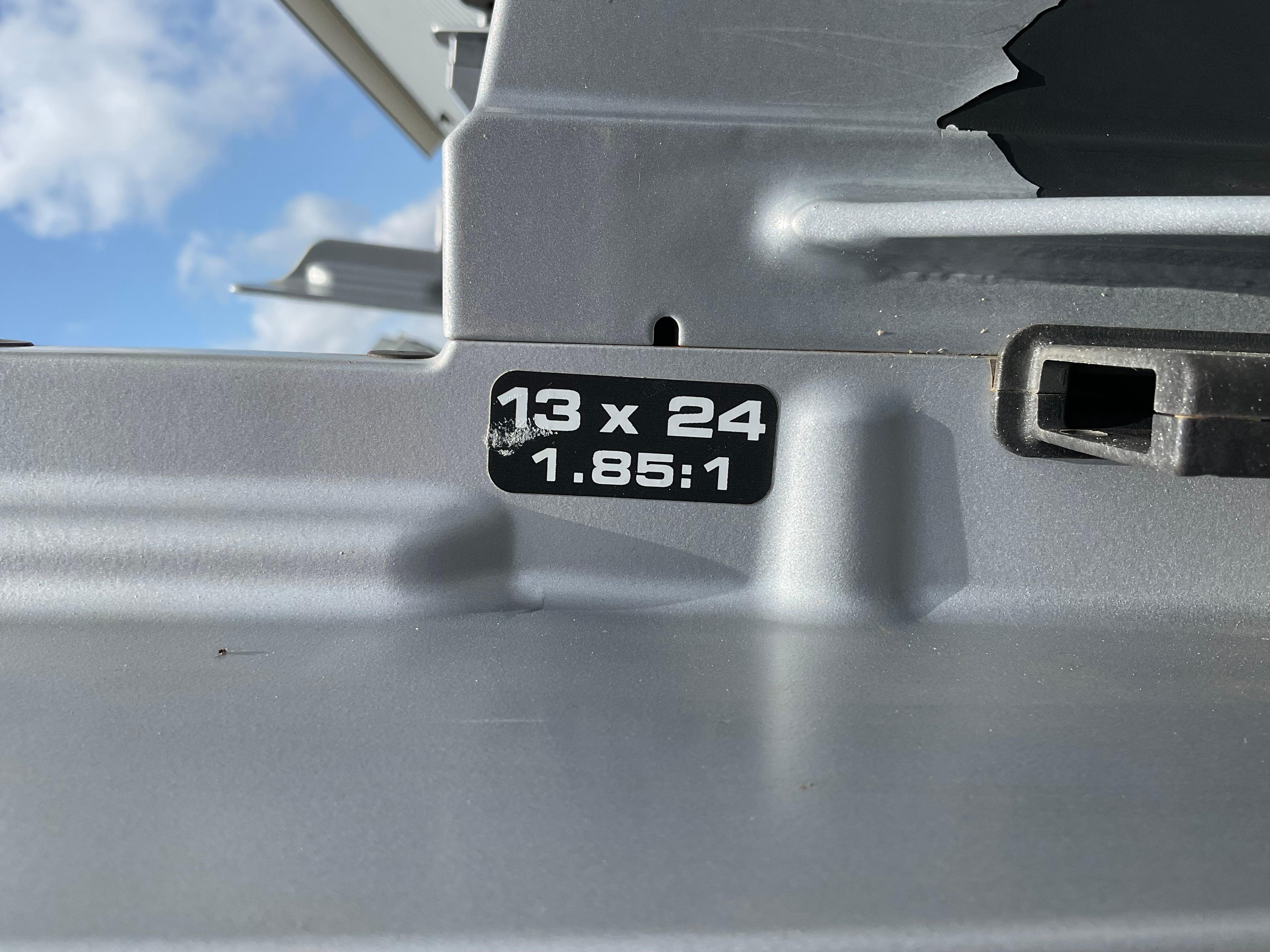 Close-up of a Protector 310 Chase 2019 boat part with "13 x 24 1.85:1" label.