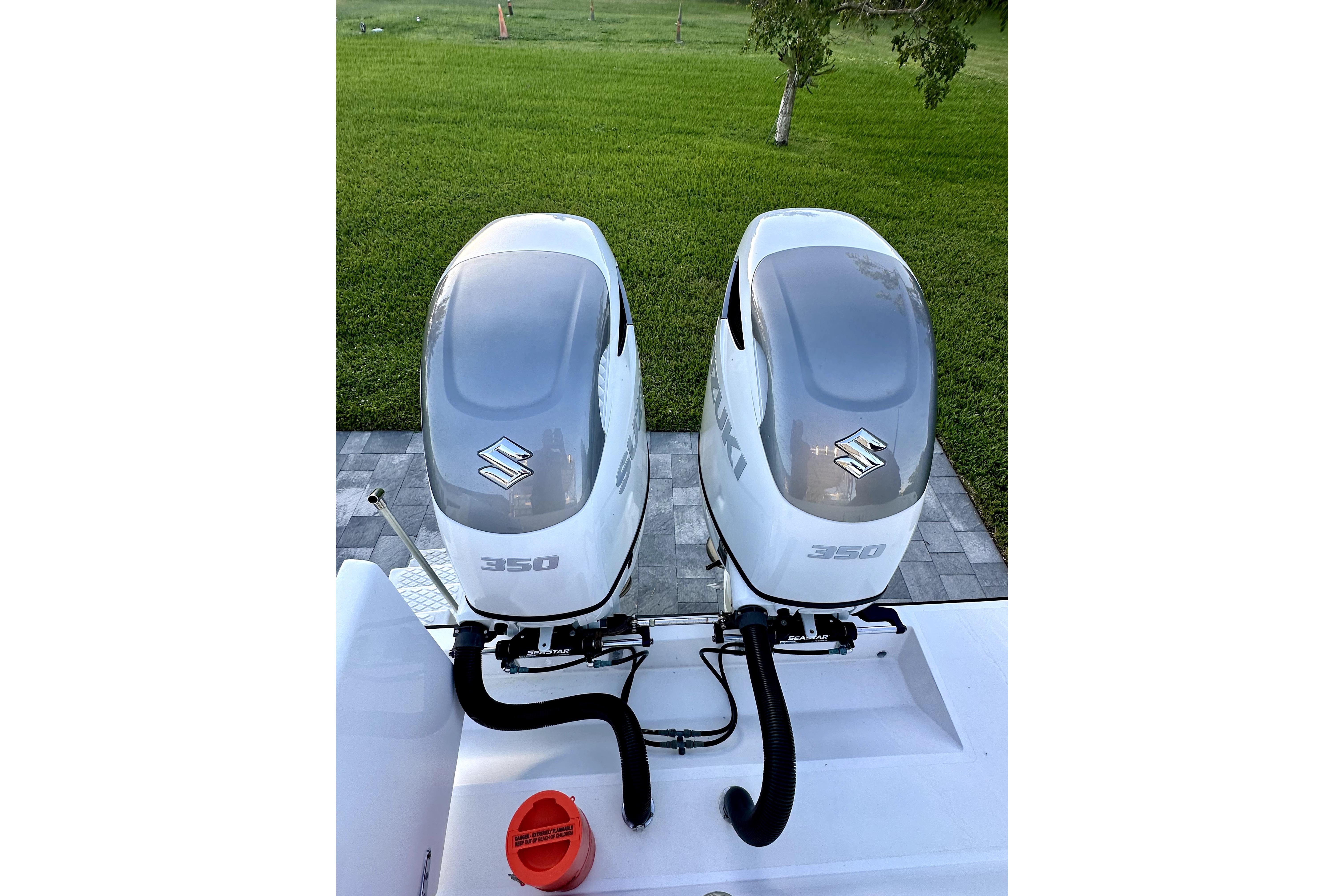 Twin Suzuki 350 outboard engines on a 2006 Contender 35 Express Side Console boat.