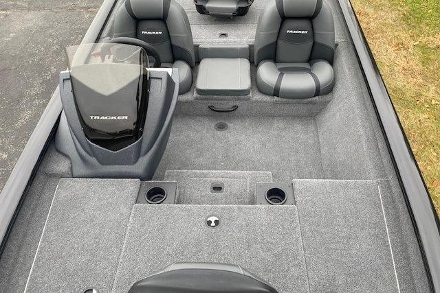 2026 Tracker Pro Team 175 boat interior with gray seating and carpeted deck.