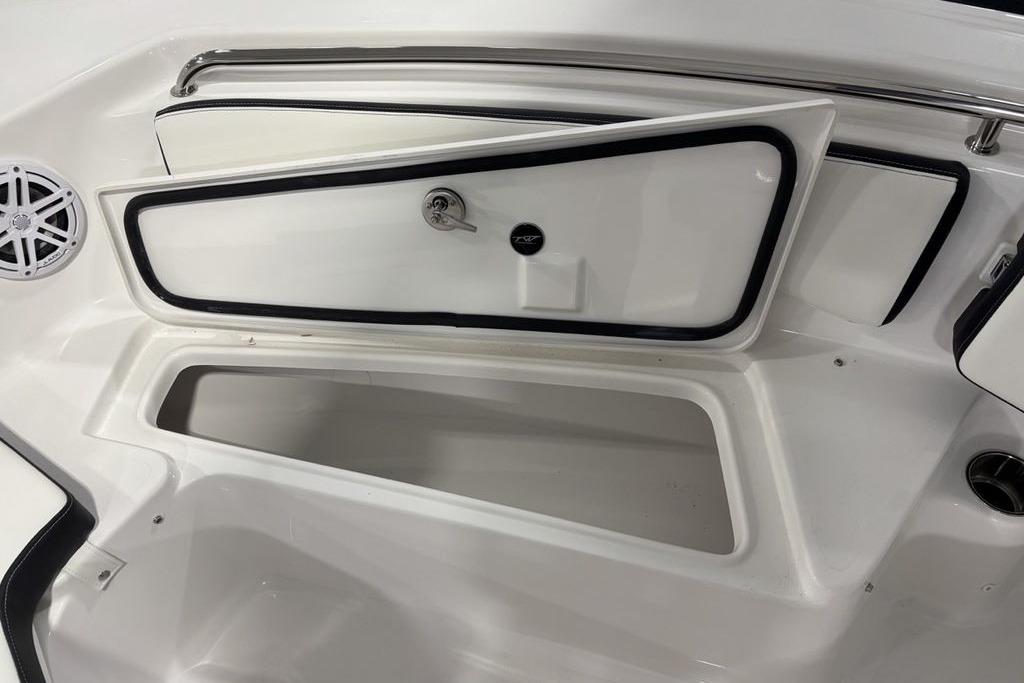 2026 Tidewater 198 CC Adventure boat storage compartment with open hatch and speaker.