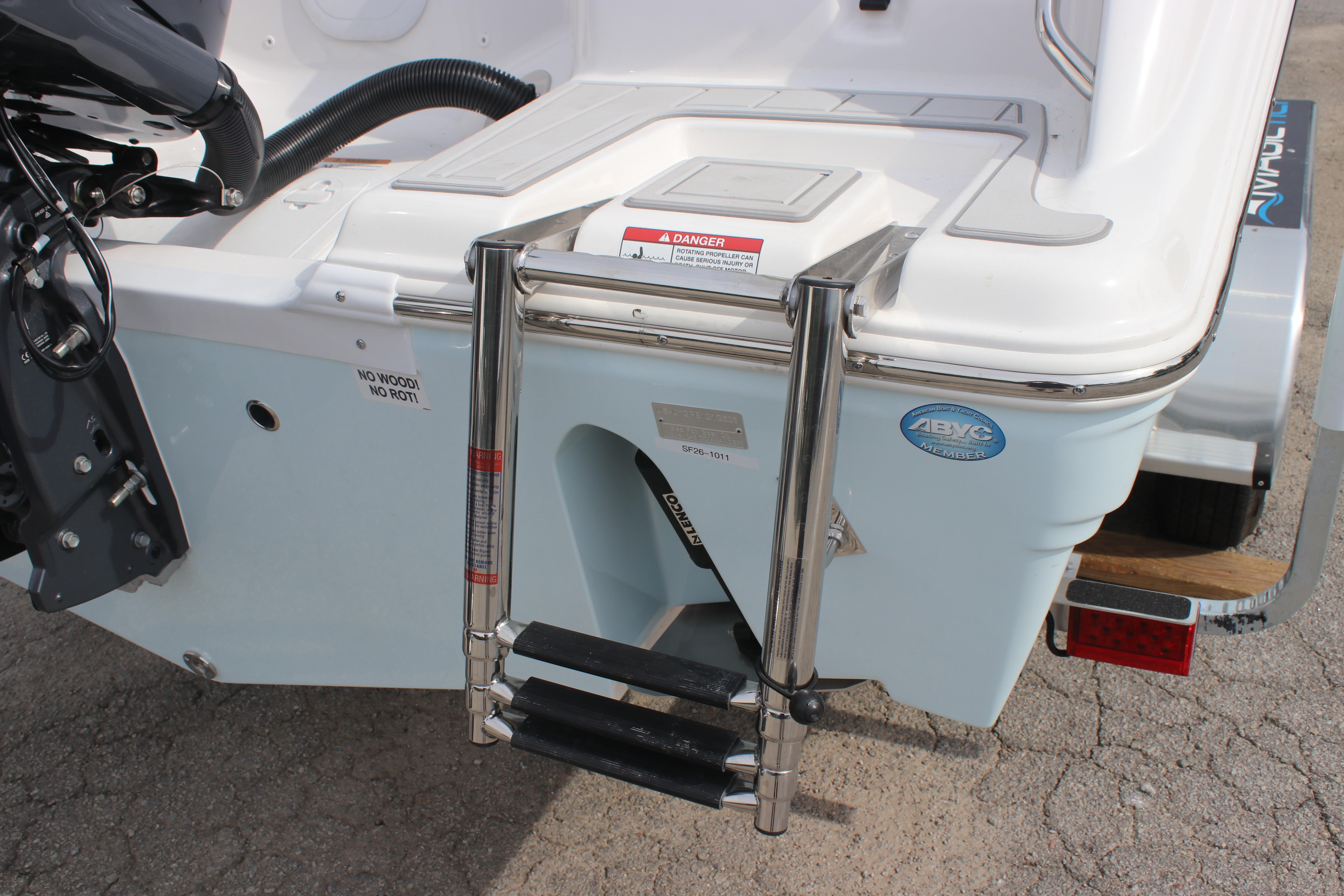 Rear view of 2026 Sea Fox 248 Commander boat with ladder and motor details.