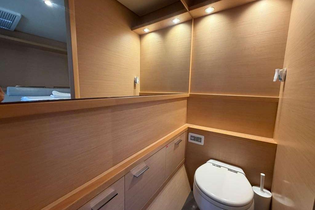 Luxurious bathroom interior of 2019 Lagoon 630 MY yacht with modern fixtures.