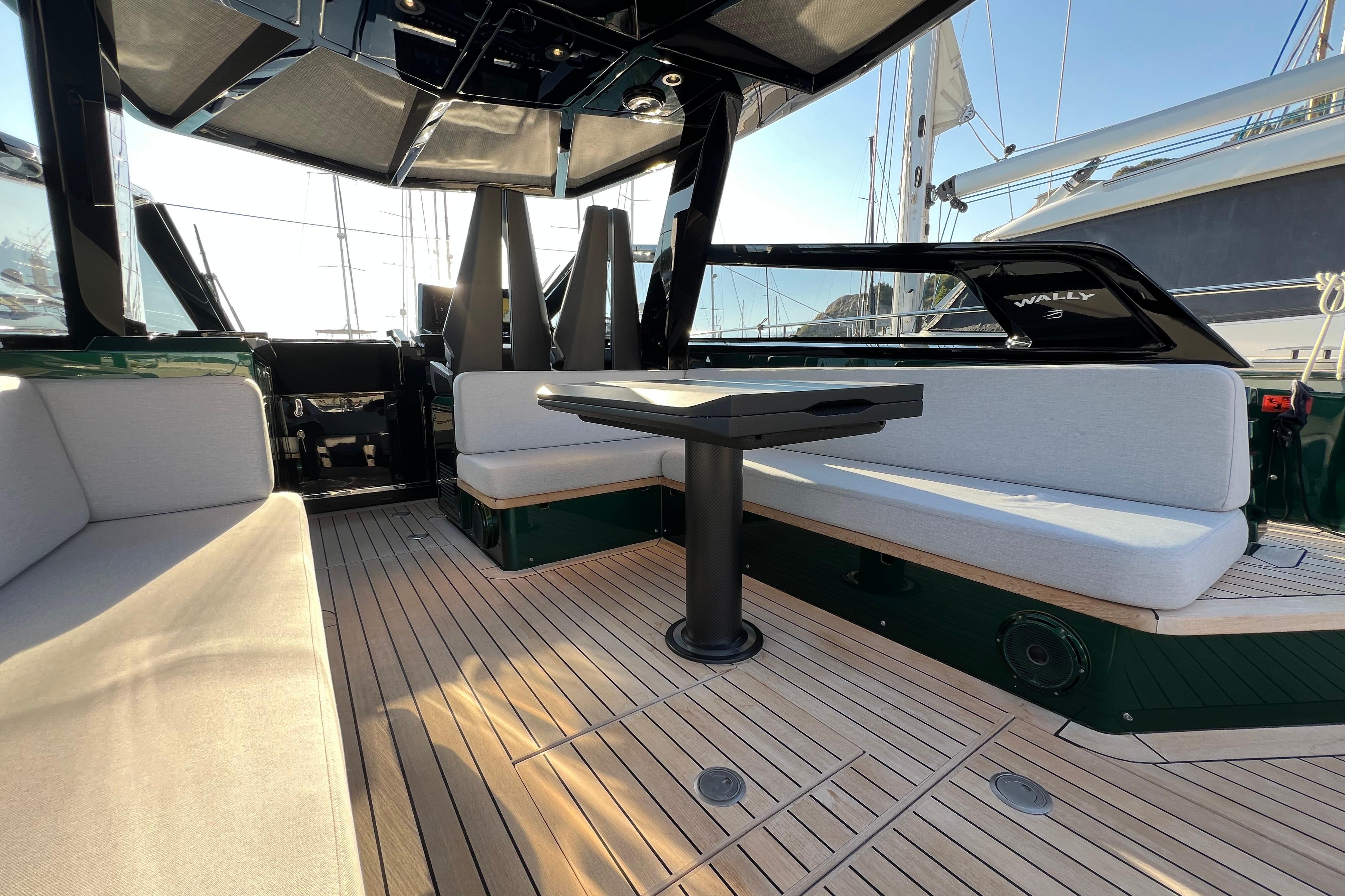 Luxurious 2024 Wally Tender 43 X yacht interior with elegant seating and table.