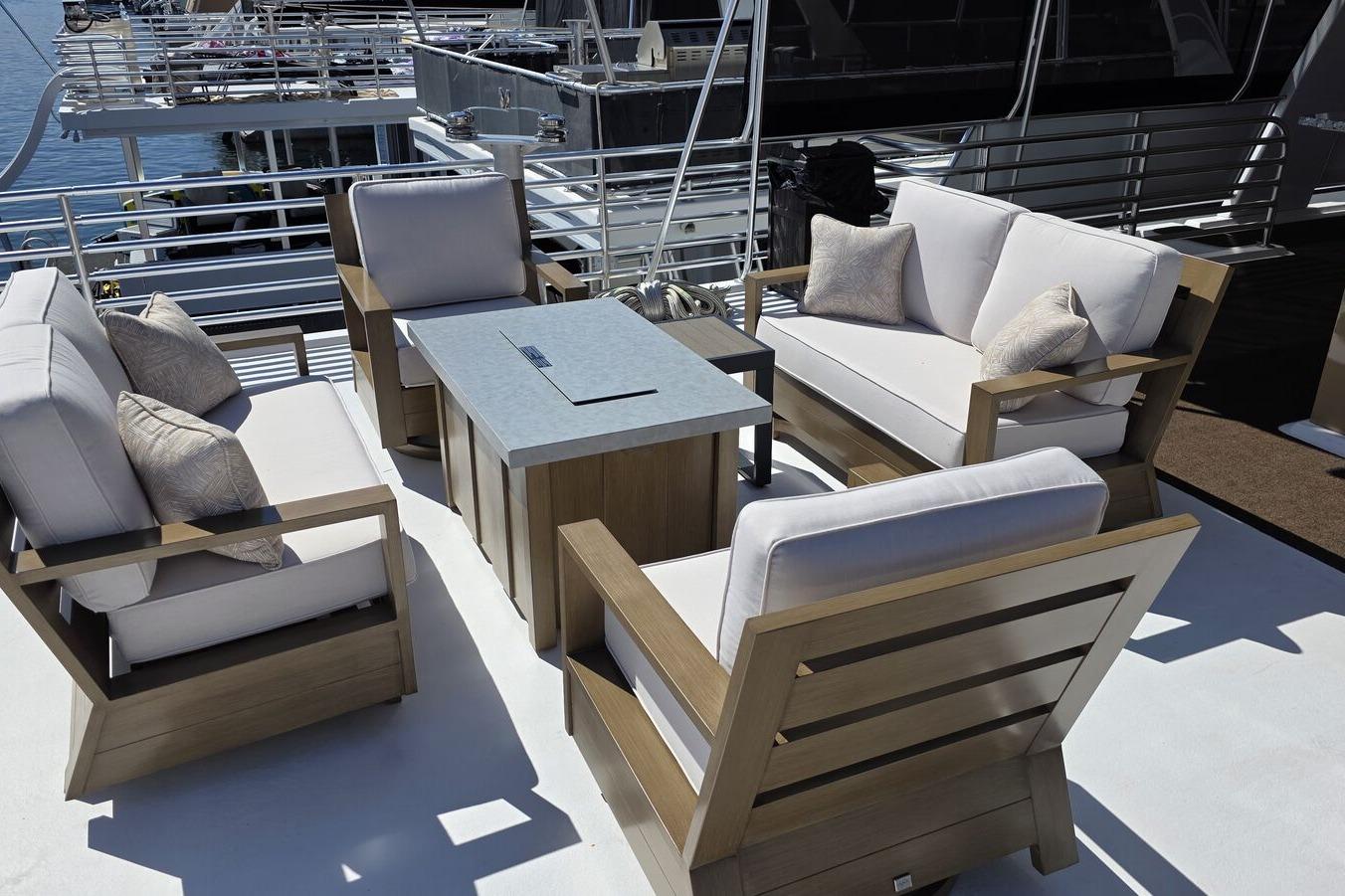 Outdoor seating area on 2025 Sumerset Excellence Multiple Shares houseboat deck.