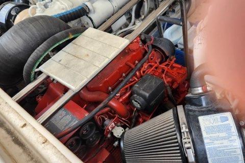 Engine compartment of a 2007 Tiara Yachts 3600 Open, featuring a red engine.