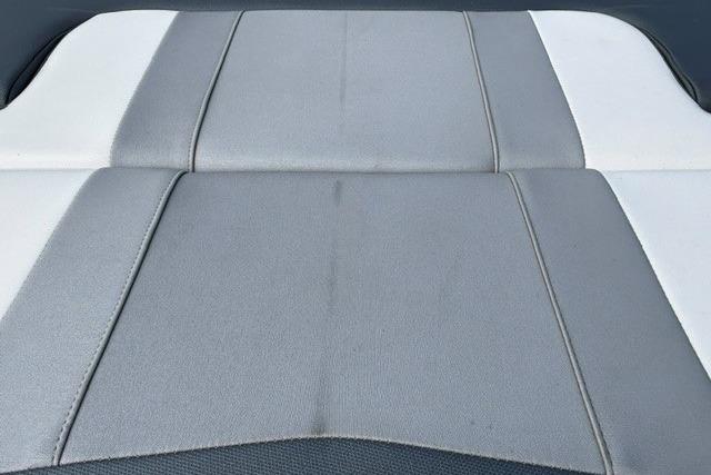 2021 Chaparral 21 SSi boat seat with gray and white upholstery design.