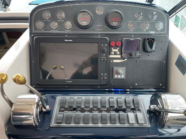 Control panel of a 2003 Tiara Yachts 3500 Open with navigation and engine controls.