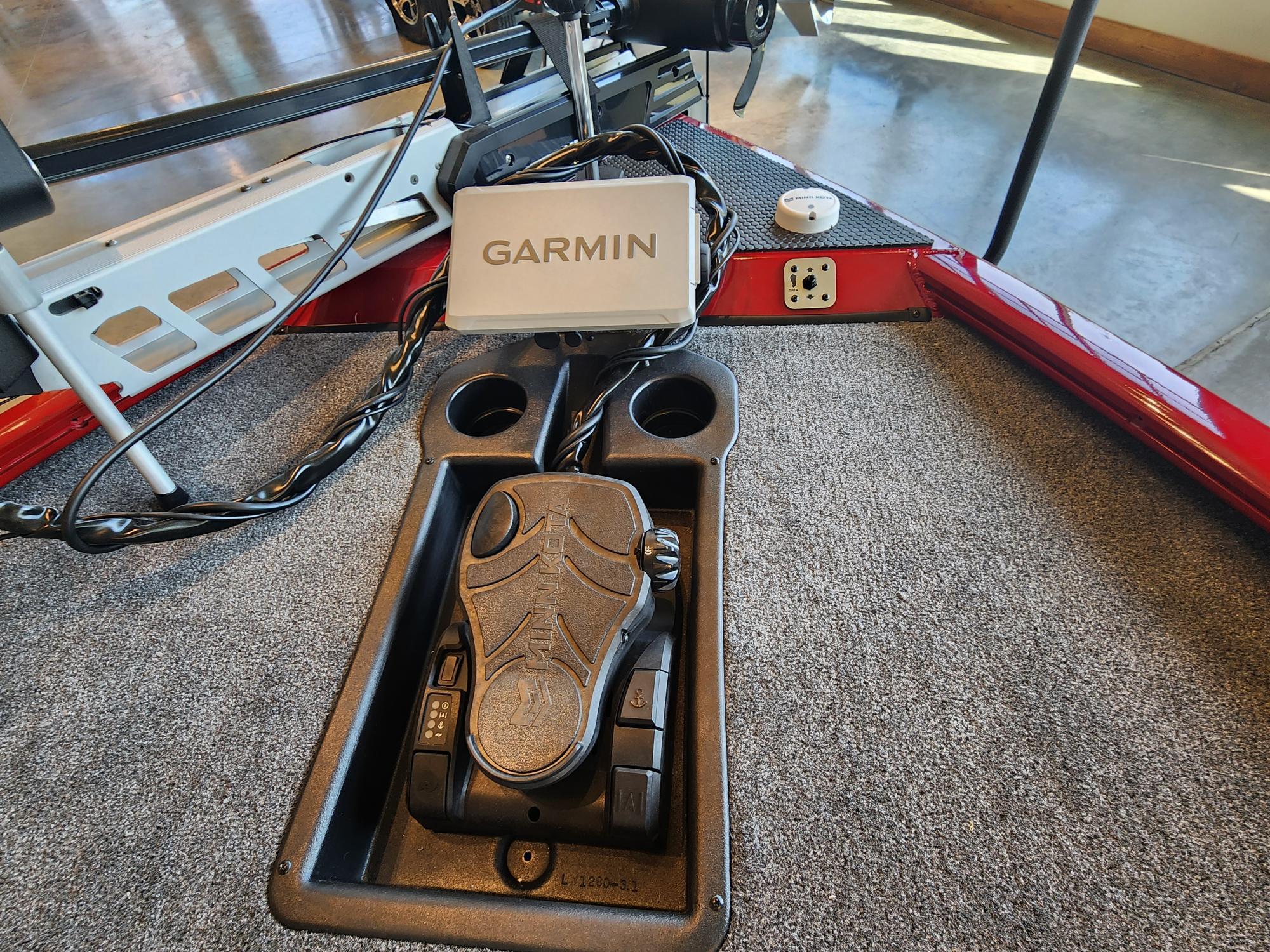 Foot pedal and Garmin device on 2025 Tracker Savage 215 boat deck.