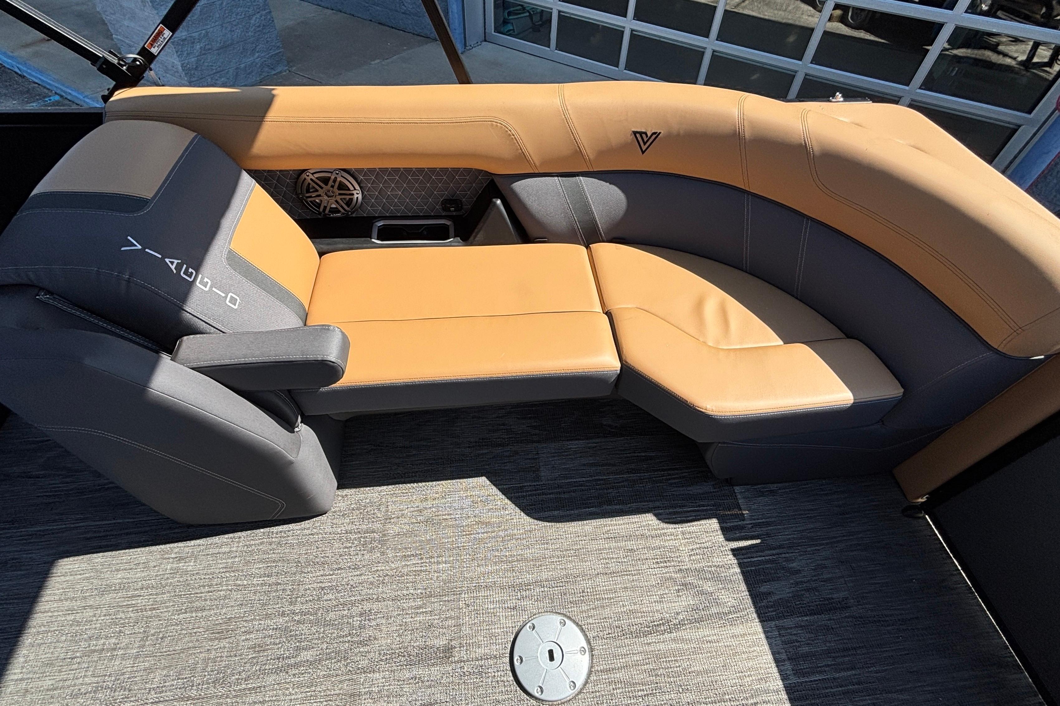 Luxurious seating in 2026 Viaggio Z24U boat, featuring tan and gray upholstery.