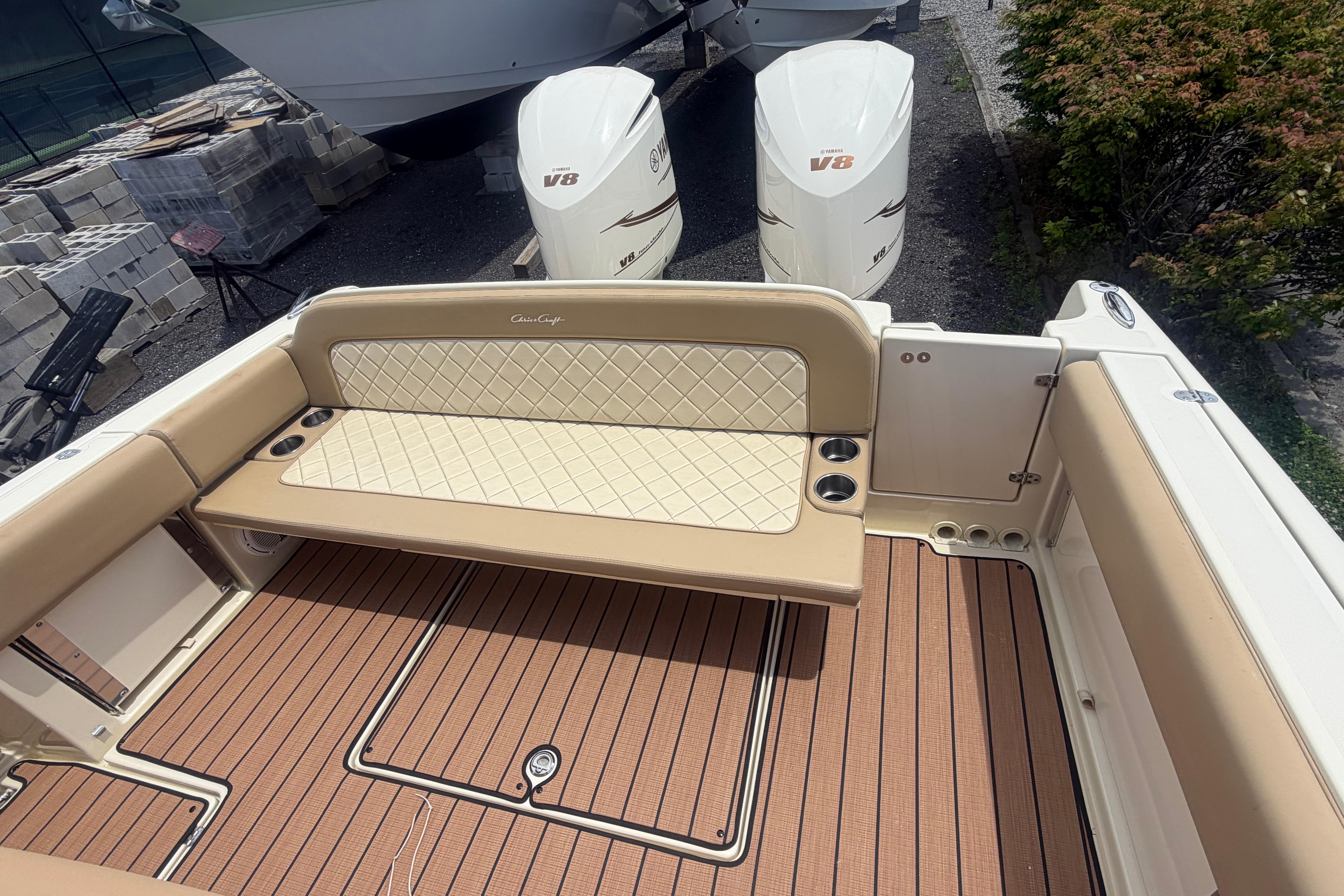 2017 Chris-Craft Catalina 34 boat interior with cushioned seating and twin V8 engines.