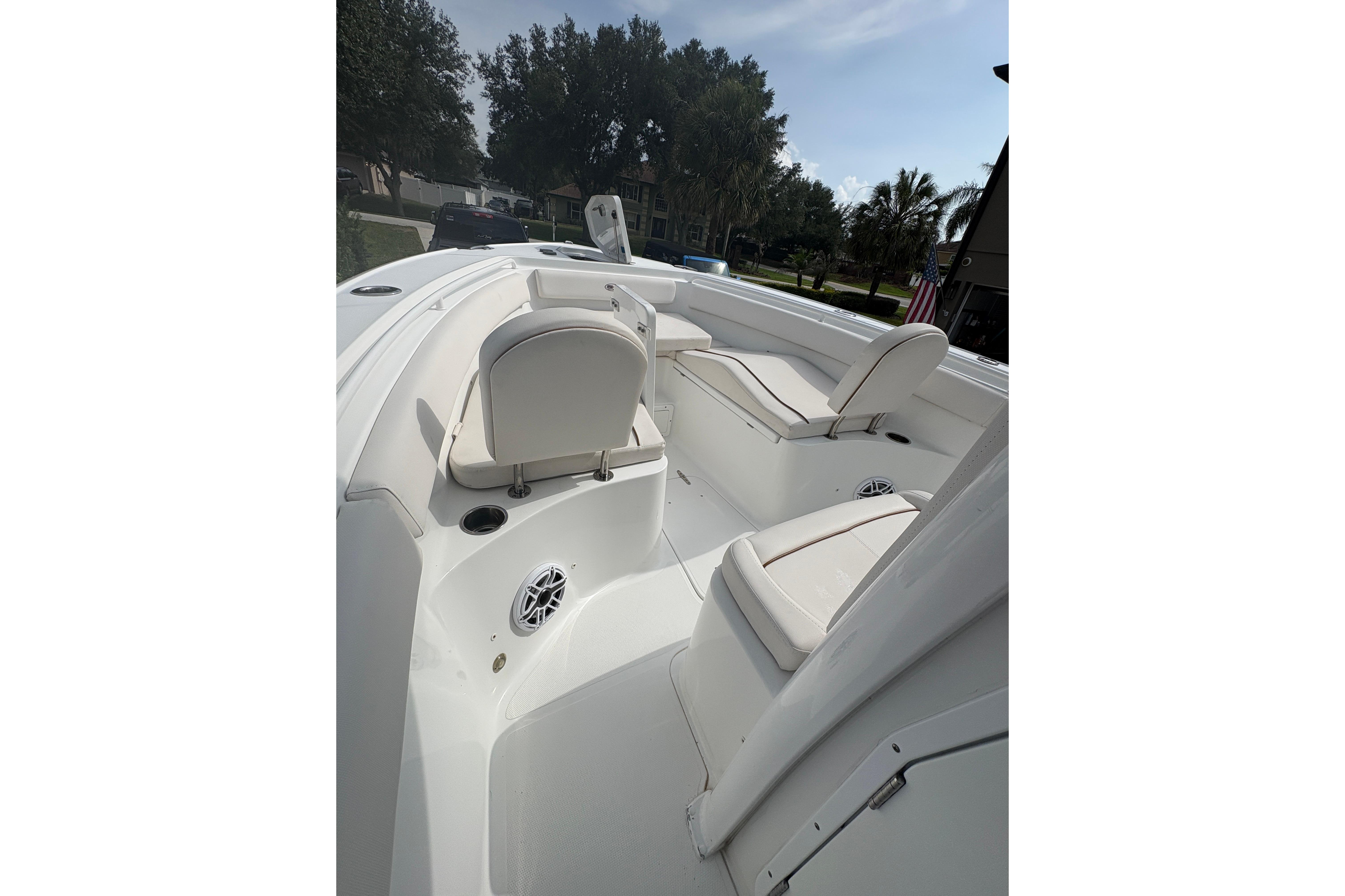2021 Sea Hunt Ultra 265 SE boat interior with white seating and sleek design.