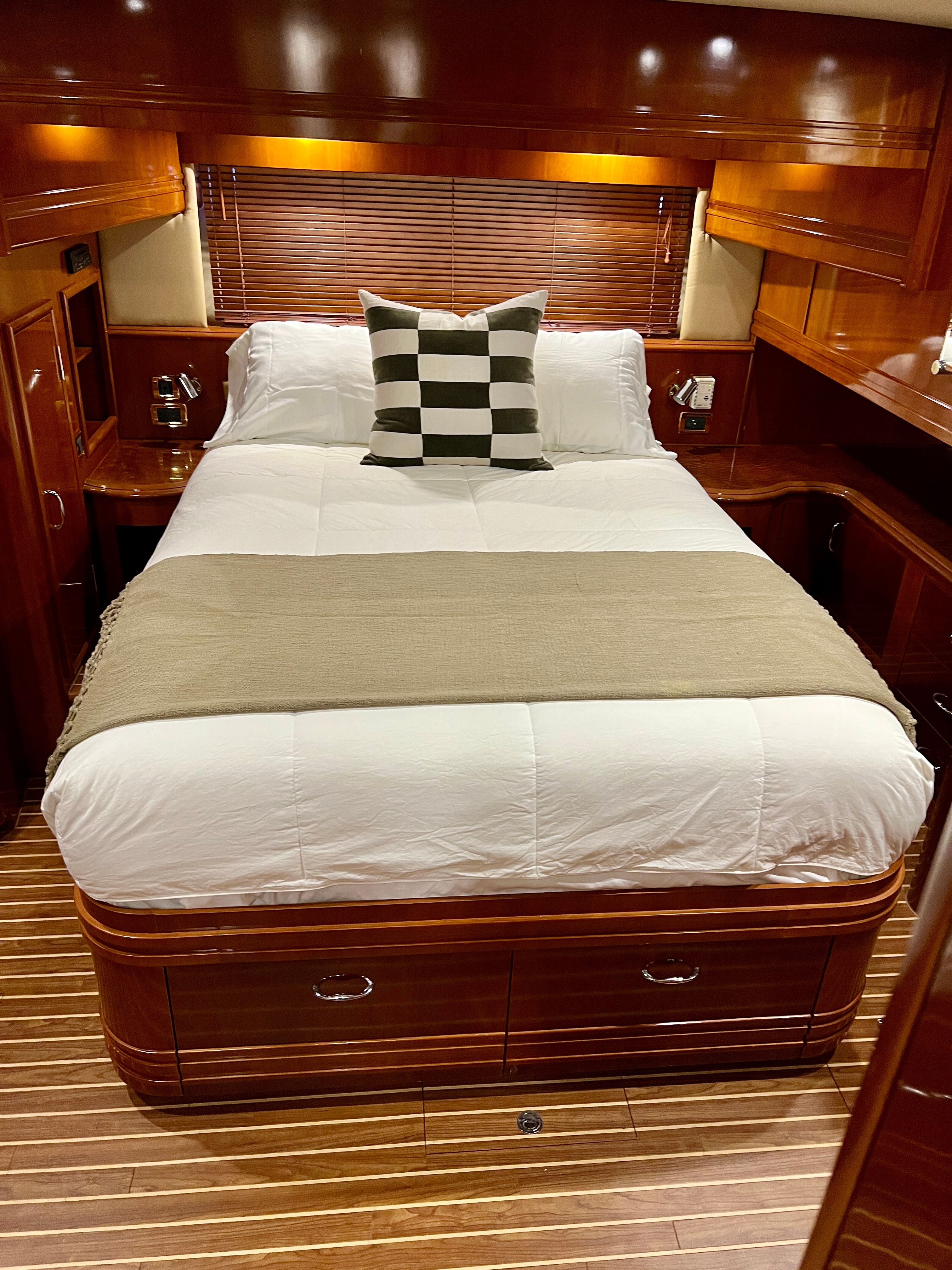 Luxurious bedroom on a 2005 Carver 560 Voyager Sky yacht.
