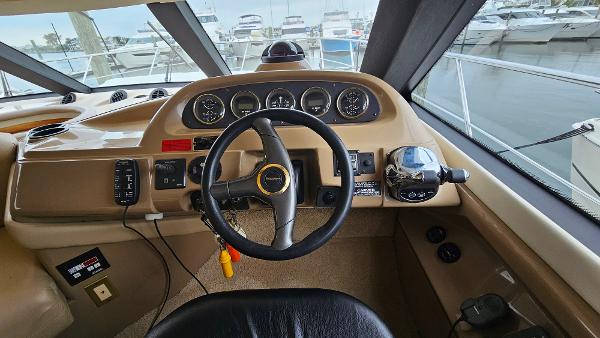 2000 Carver 450 Voyager Pilothouse helm with steering wheel and instrument panel.