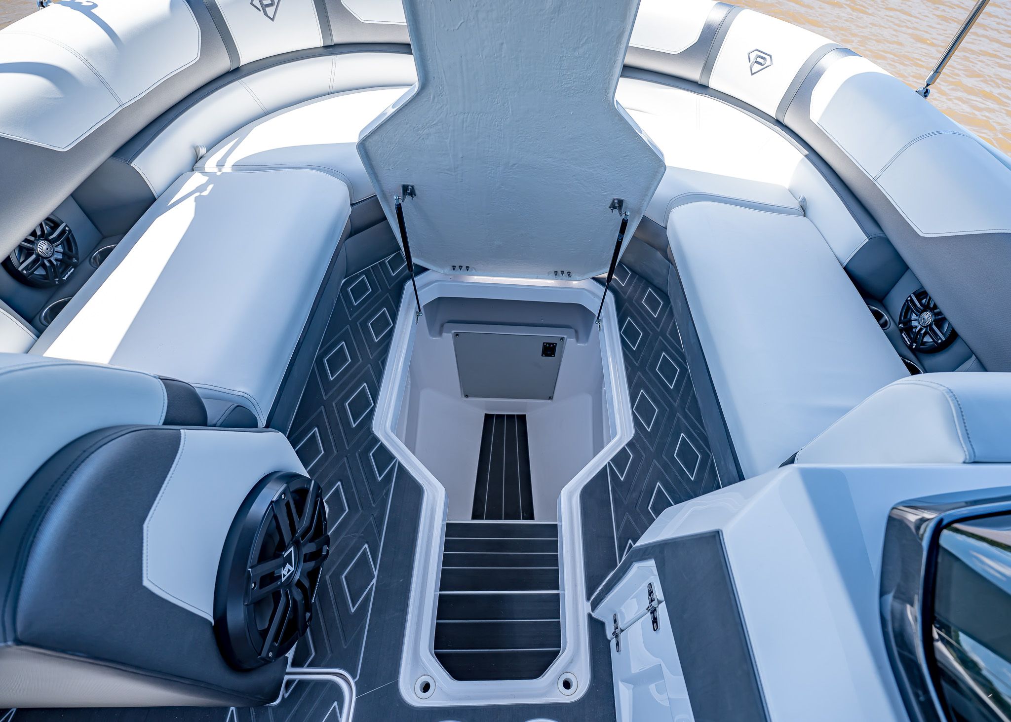 Interior of 2025 Paradigm 266 SL SURF boat with seating and storage.