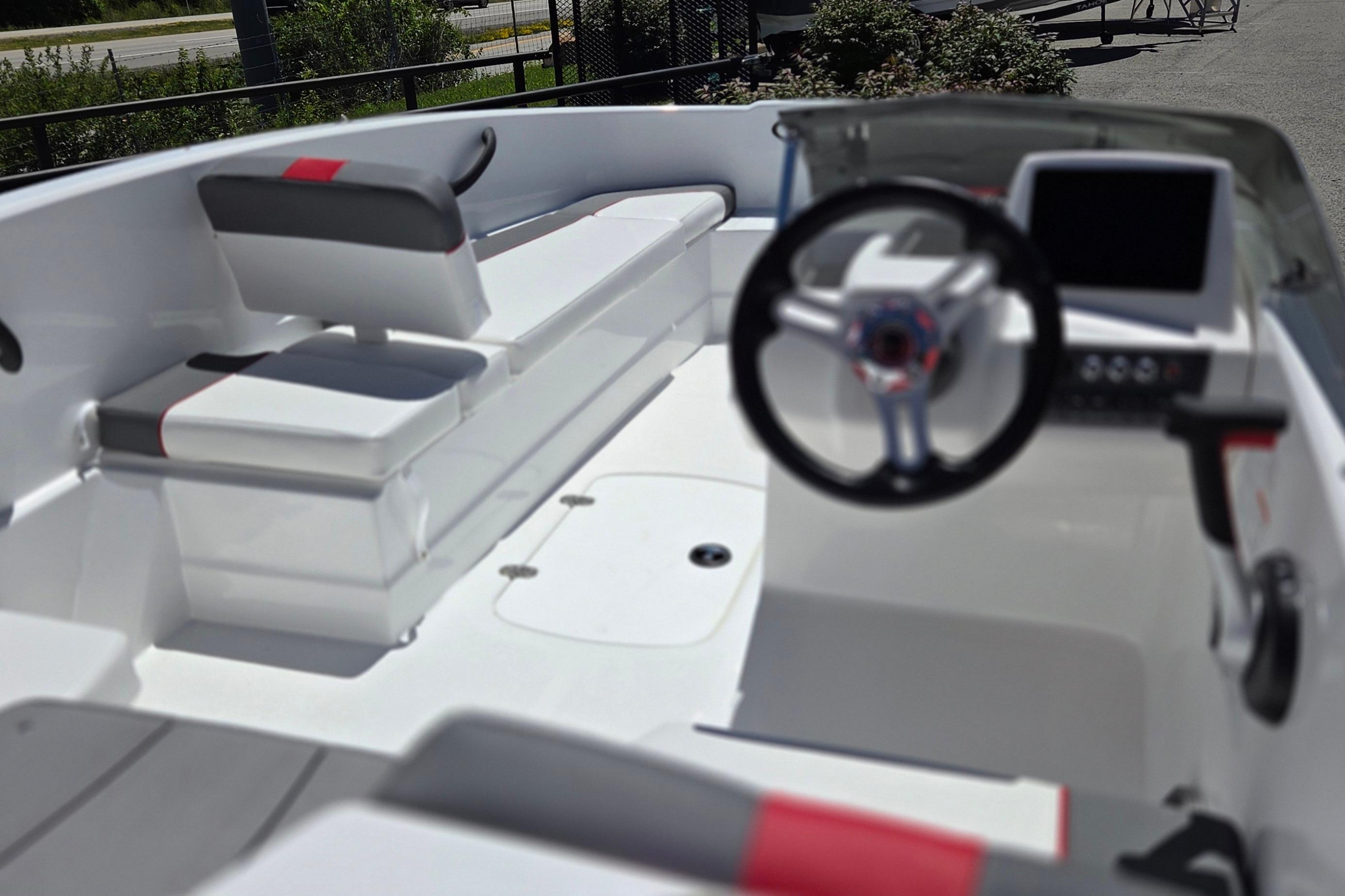 2026 Tahoe T16 boat interior with modern steering and seating design.