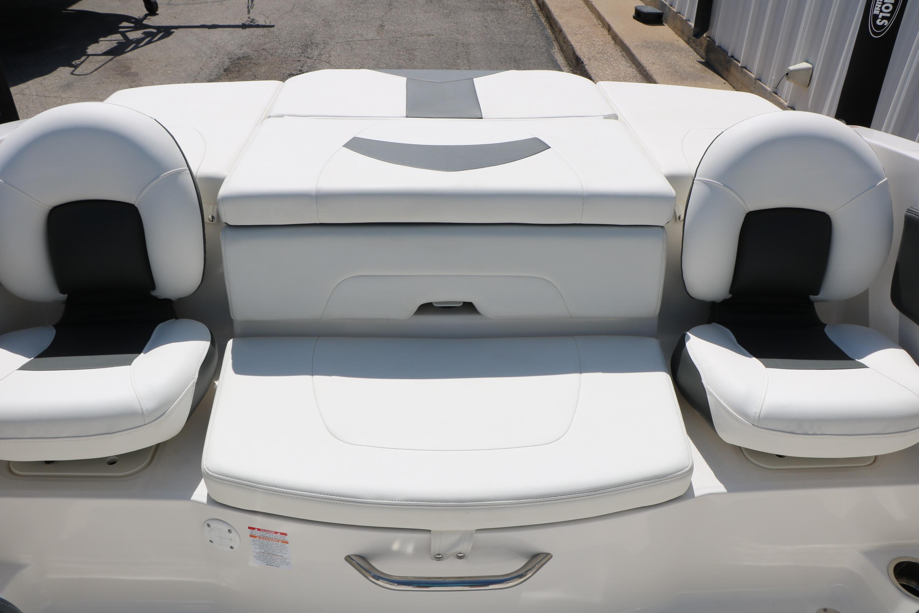 2025 Chaparral 21 SSi Ski & Fish boat interior with white cushioned seating.