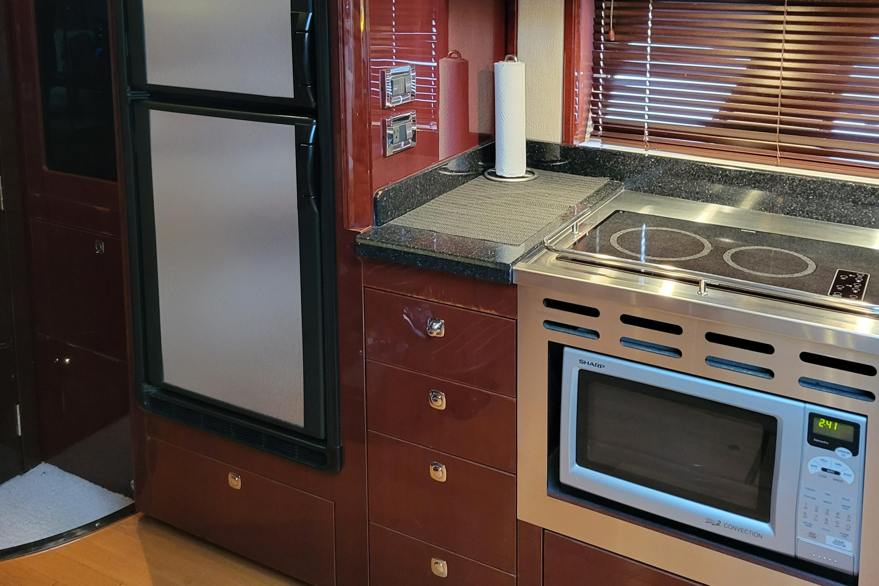 Kitchen area of a 2009 Sea Ray 500 Sundancer yacht with modern appliances.