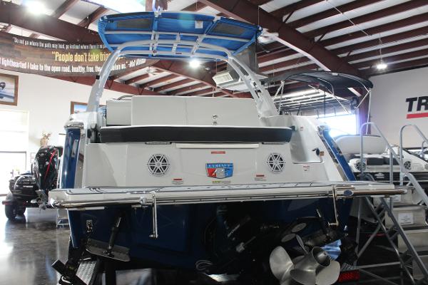 2025 Cobalt R6 boat in showroom, rear view with propeller and swim platform.