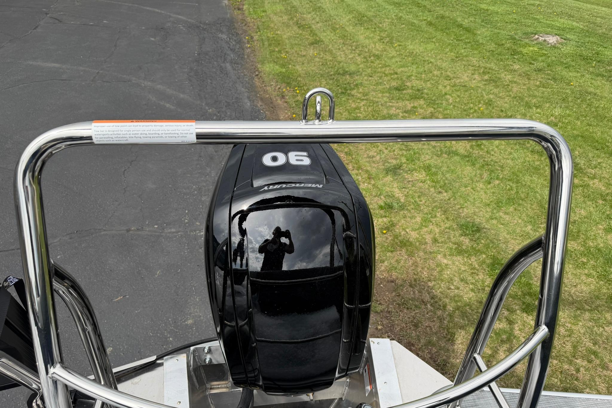 Rear view of a 2026 Lowe LS 190 boat with a Mercury 90 engine.