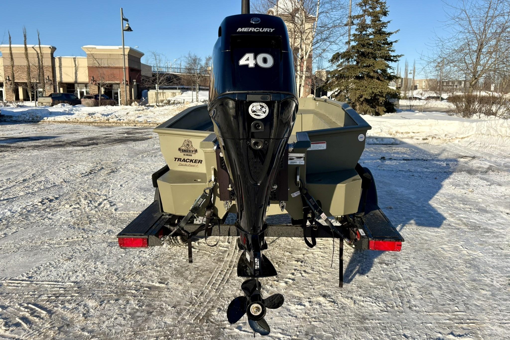 2025 Tracker Grizzly 1650 T Prairie Wings Edition boat with Mercury 40 engine in snowy setting.