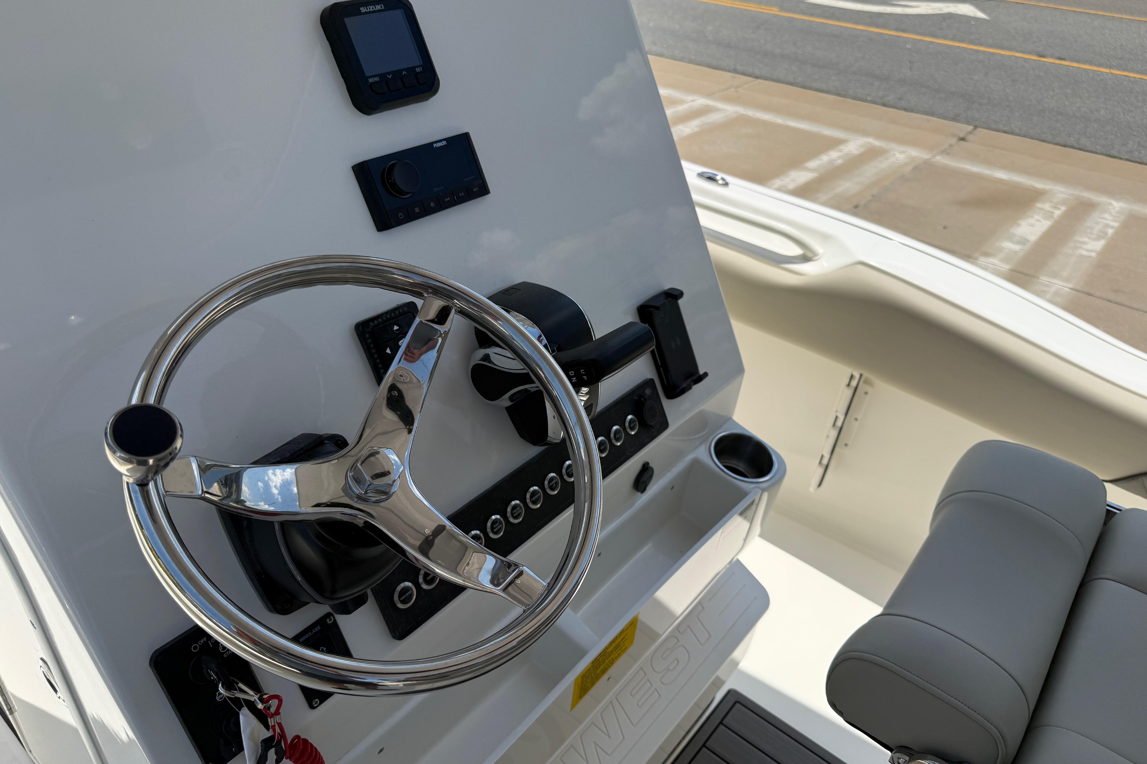 Steering console of 2027 Key West 249 FS boat with modern controls and seating.