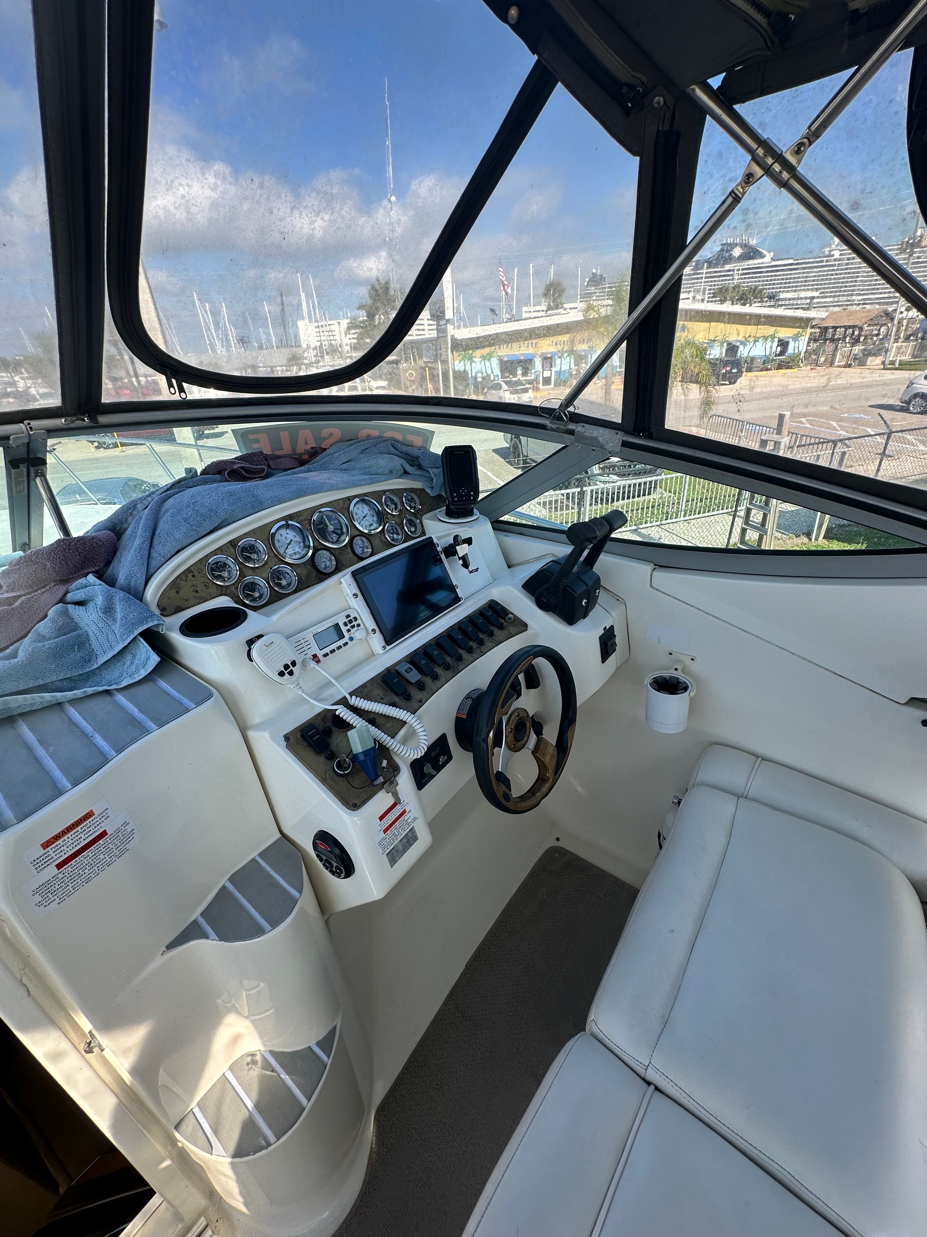 Interior view of 1999 Wellcraft 3000 Martinique cockpit with controls.