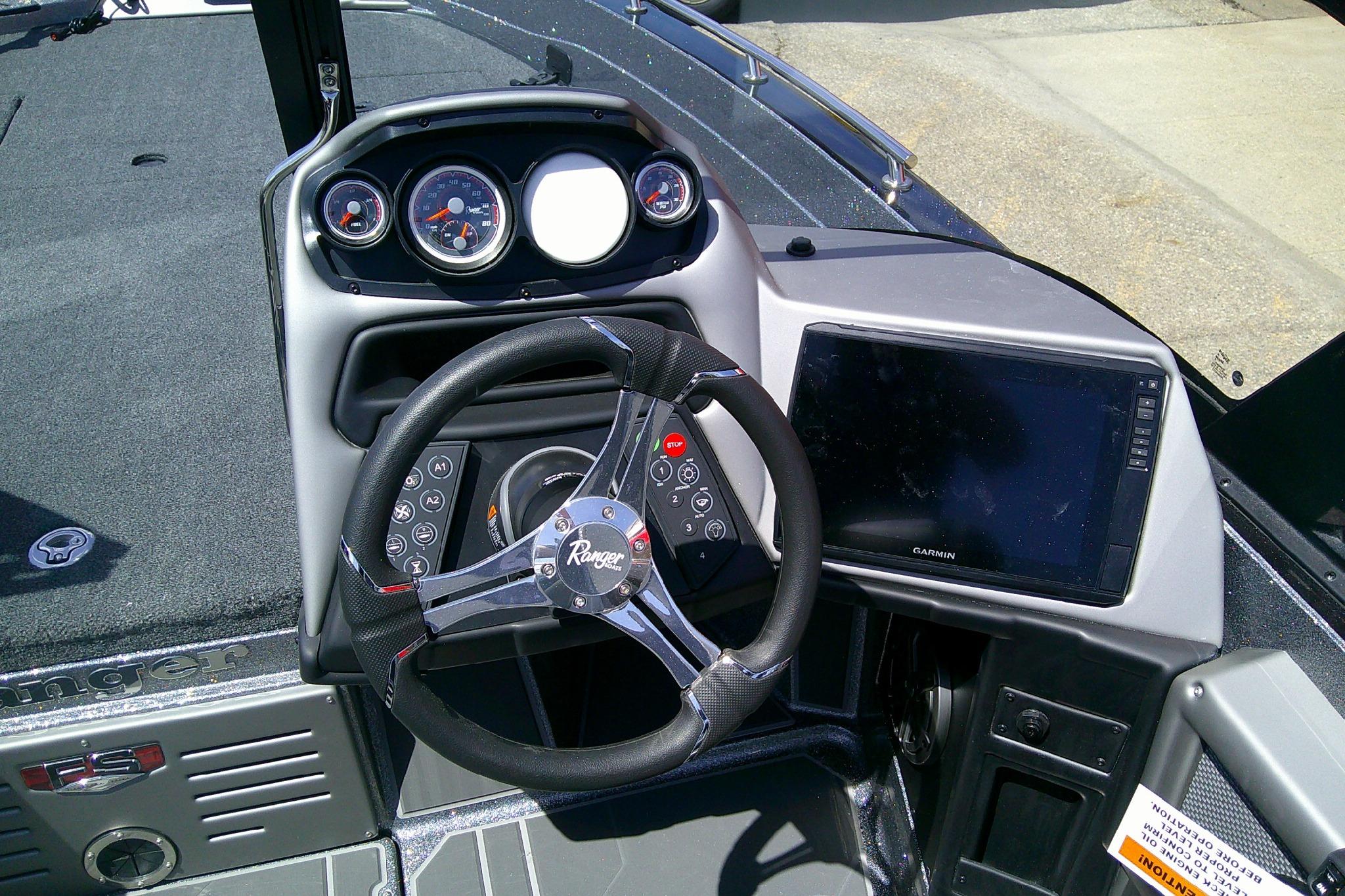 2026 Ranger 620FS Cup-Equipped boat dashboard with steering wheel and Garmin display.