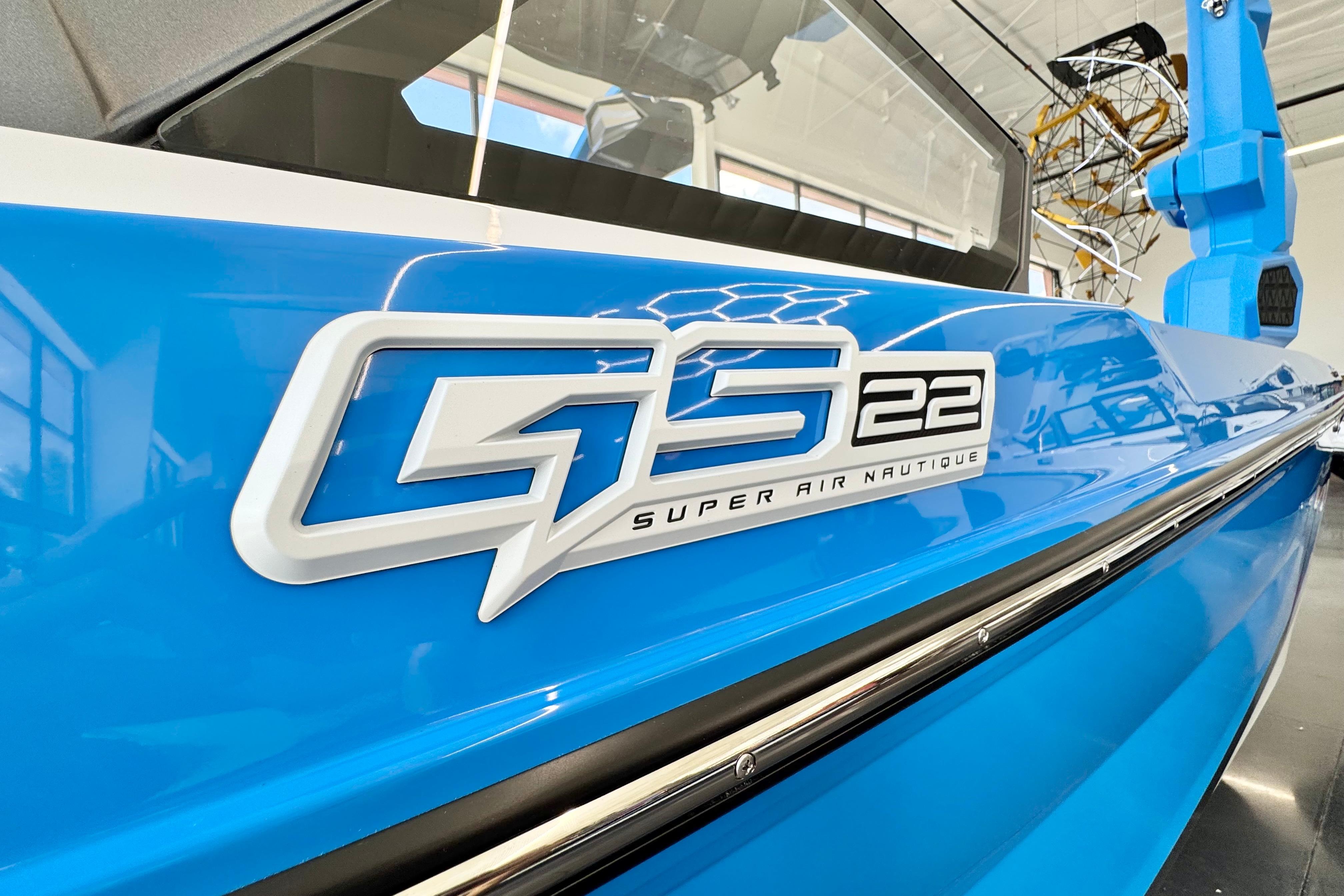 2026 Nautique Super Air Nautique GS22 boat, blue exterior with GS22 logo.