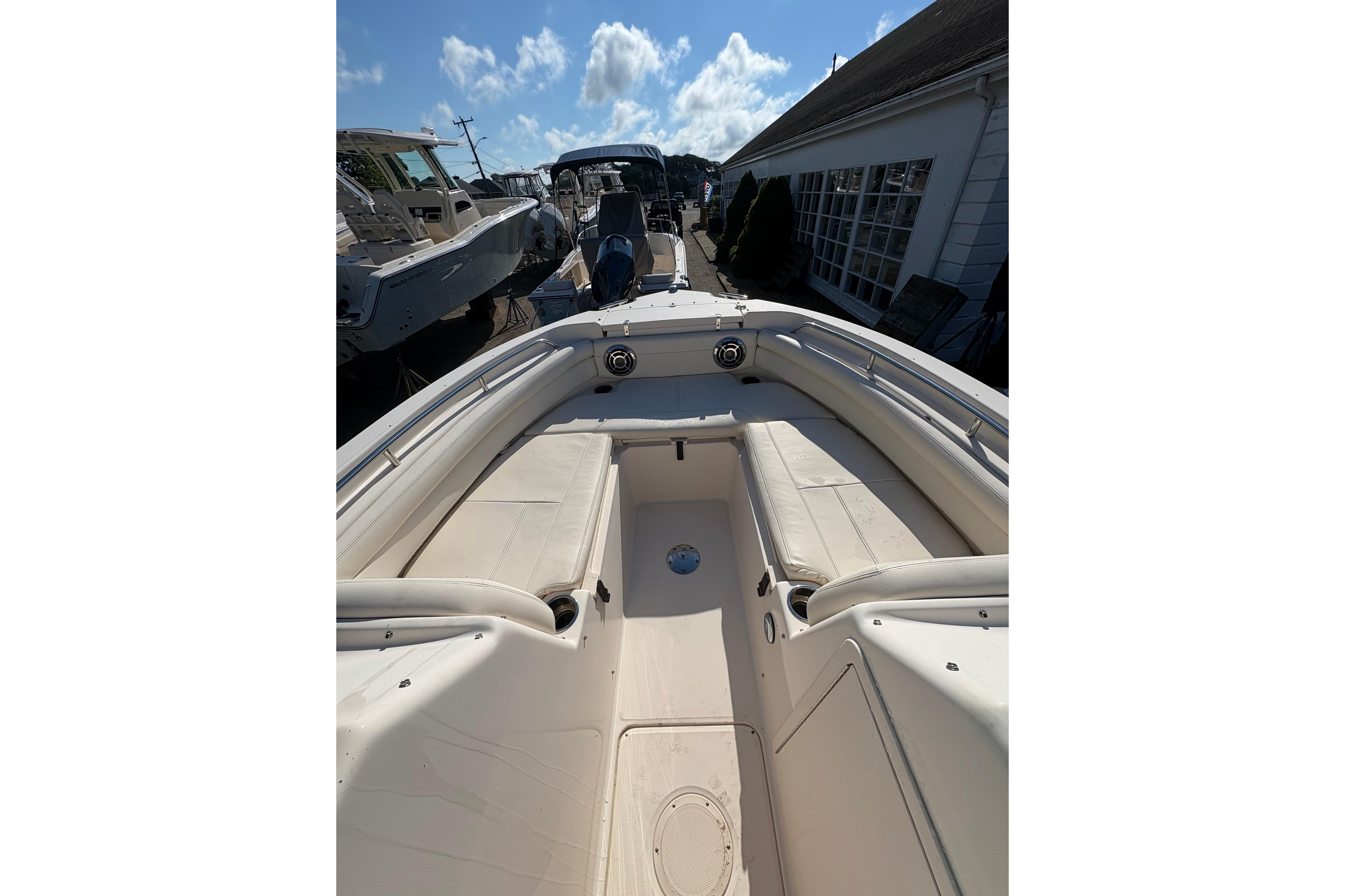 2015 Grady-White Freedom 225 boat interior with seating and clear sky background.