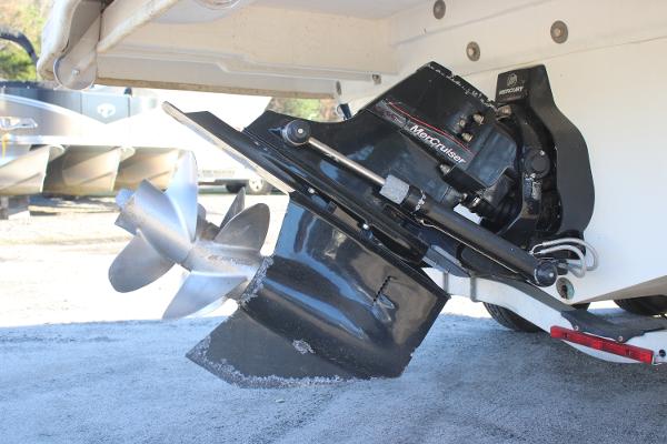 Close-up of a 2016 Sea Ray 240 Sundeck's MerCruiser outdrive and propeller.