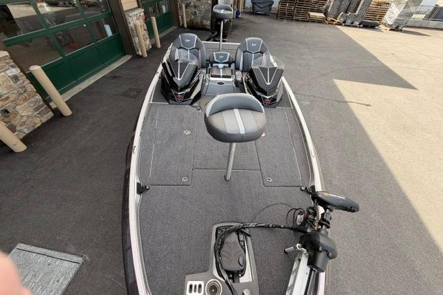 2026 Ranger Z519R fishing boat with dual seats and trolling motor, parked outdoors.