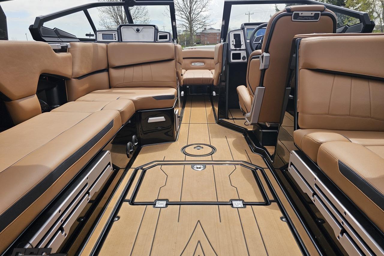 2022 Supra SE 550 boat interior with luxurious tan seating and sleek design.