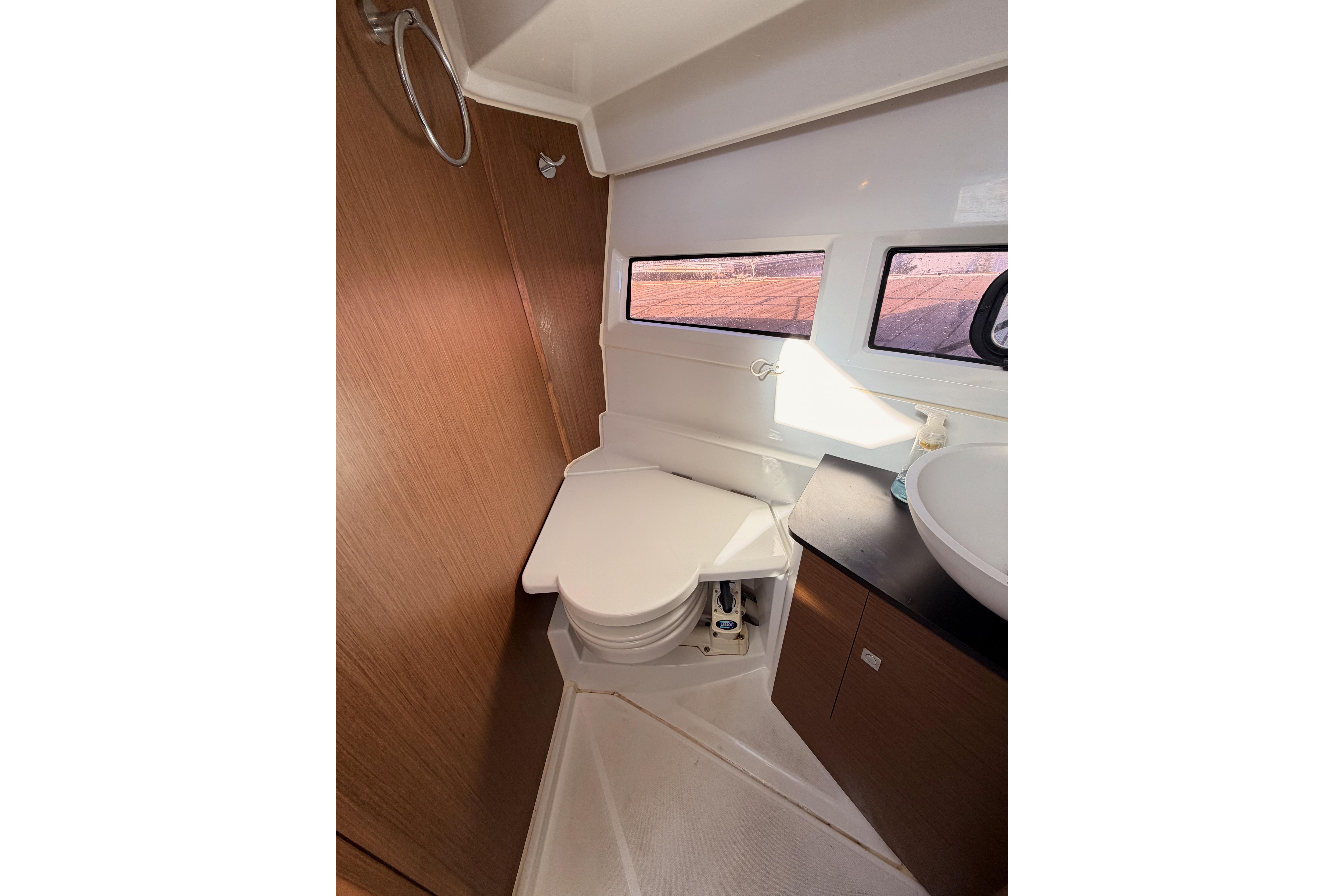 Interior of 2020 Jeanneau NC 895 boat bathroom with toilet and sink.
