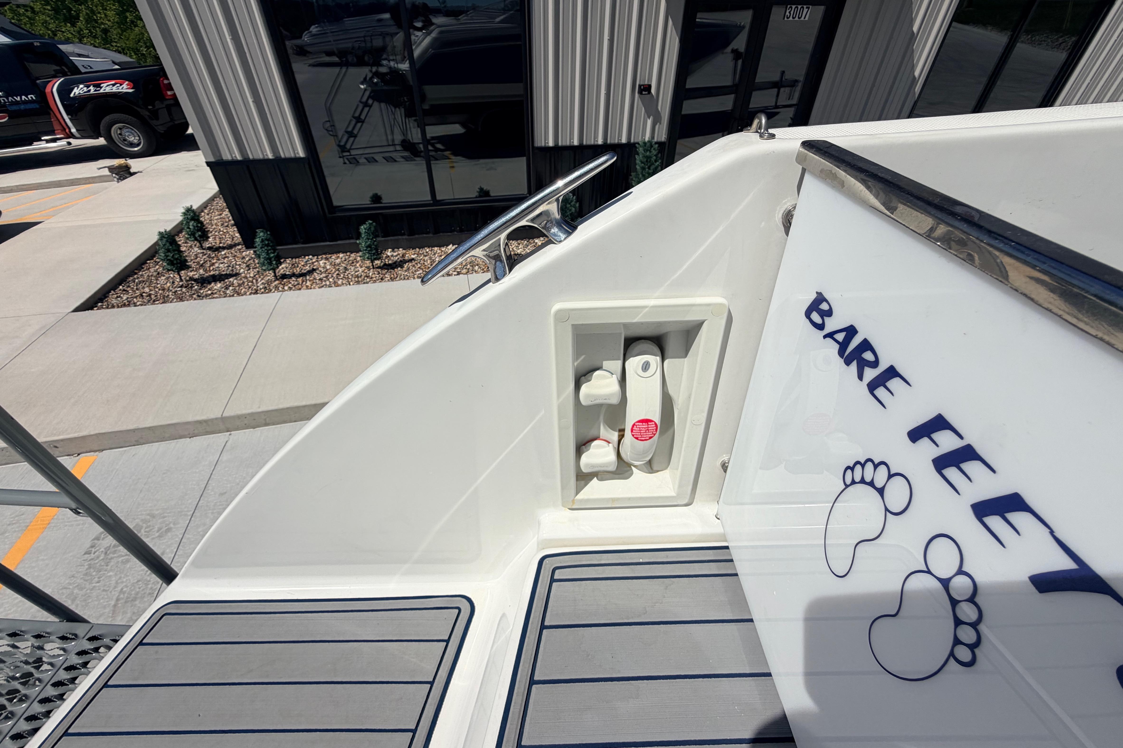 2002 Formula 330 Sun Sport boat deck with "Bare Feet" decal and foot graphics.