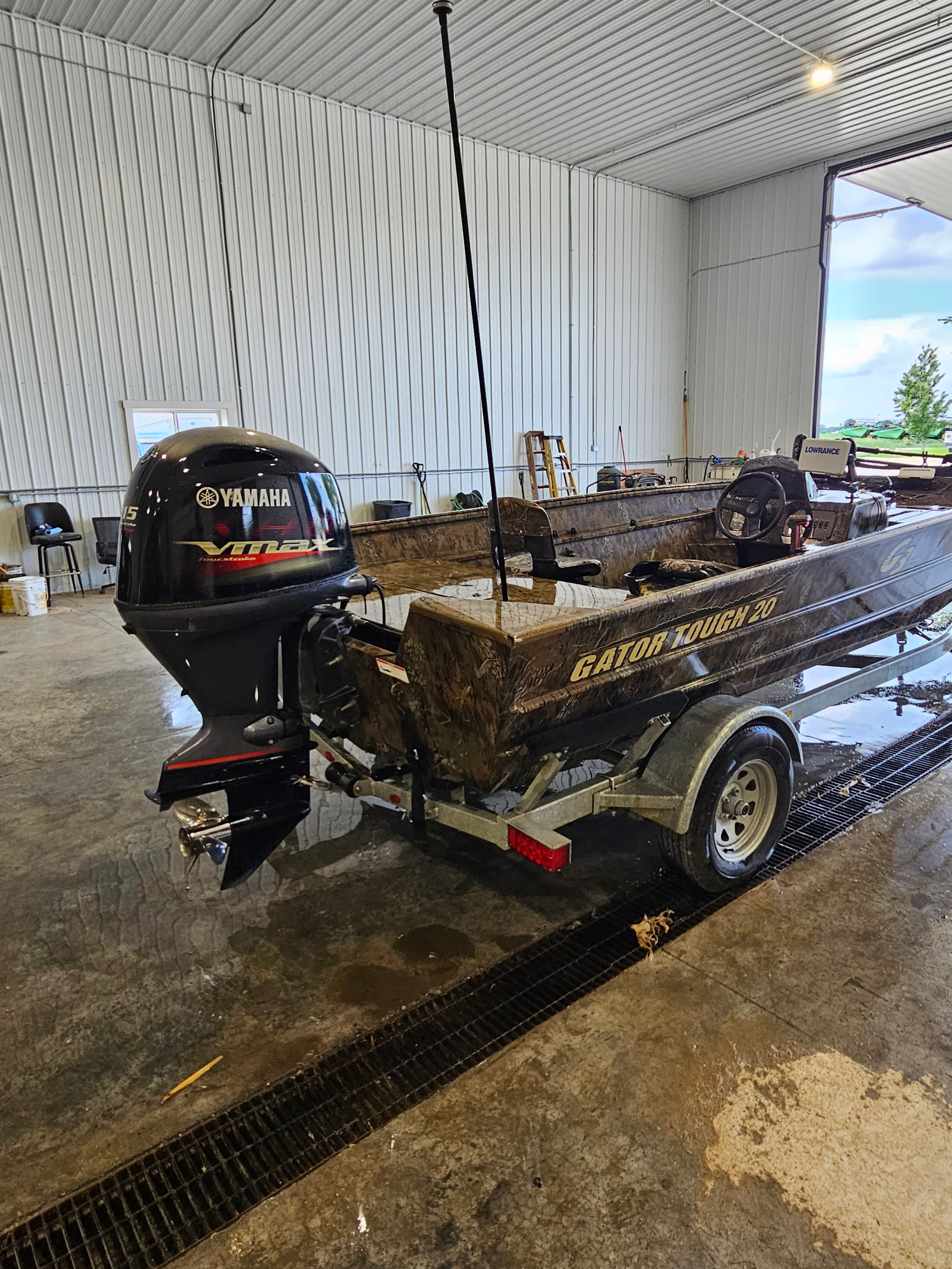 A 2021 G3 Gator Tough 20 SC boat on a trailer inside a warehouse.