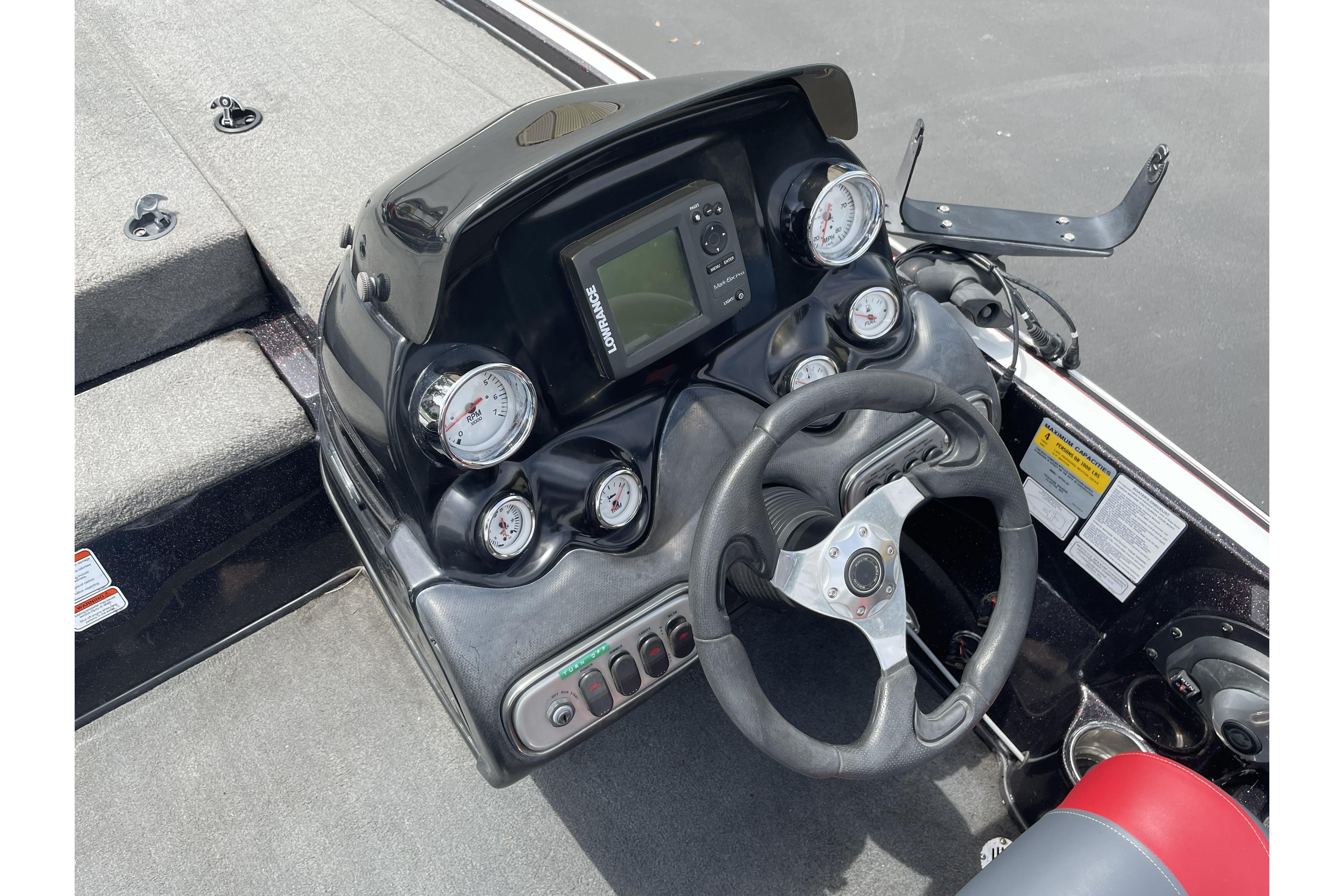 Steering console of a 2013 Nitro Z-8 boat with gauges and navigation system.