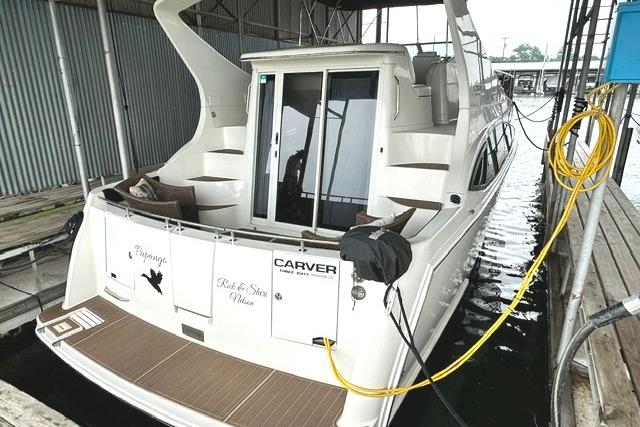 2004 Carver 360 Mariner docked in a covered marina slip.