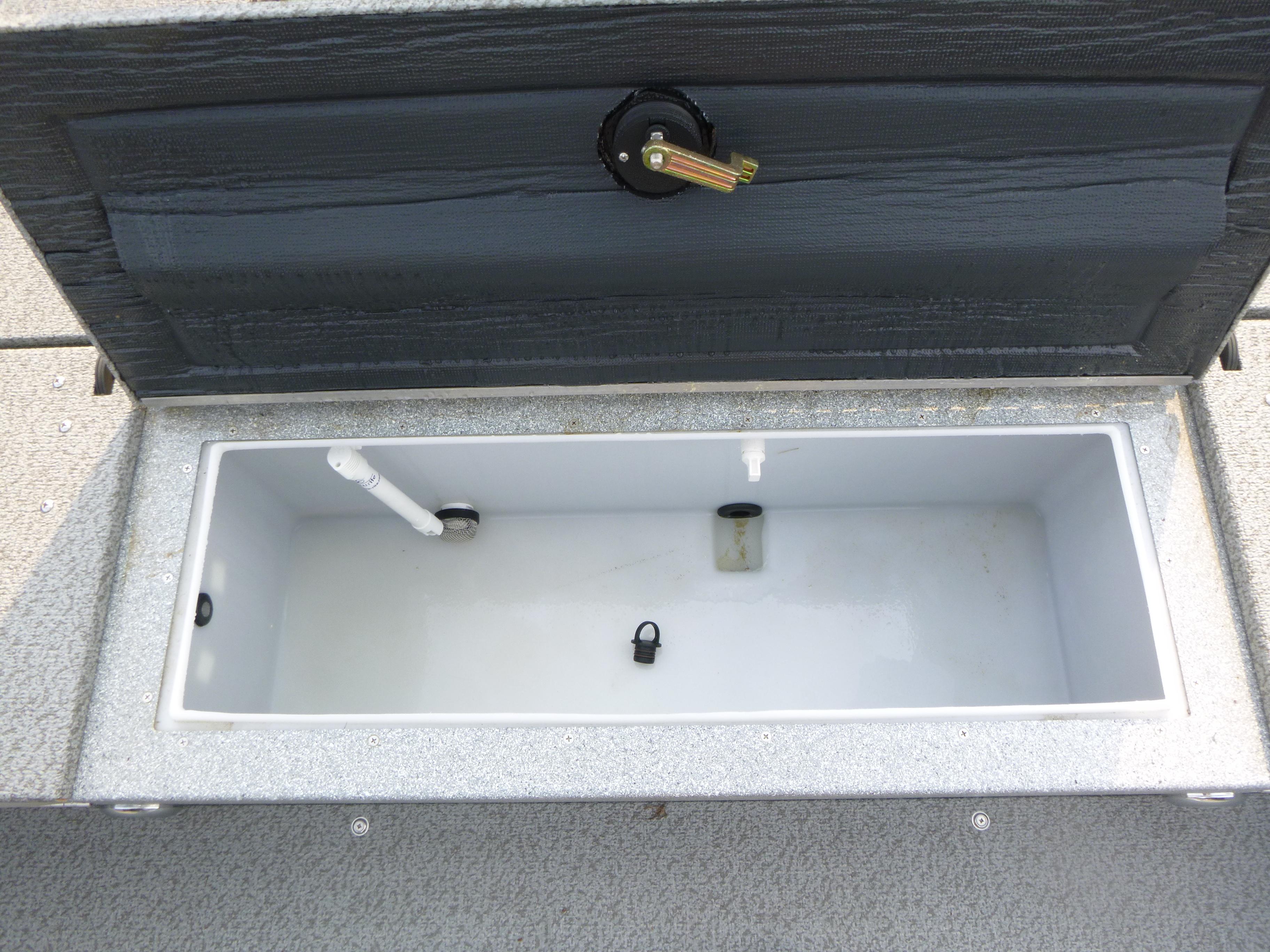 Open storage compartment in 2025 KingFisher 2125 Arrow Sport boat.