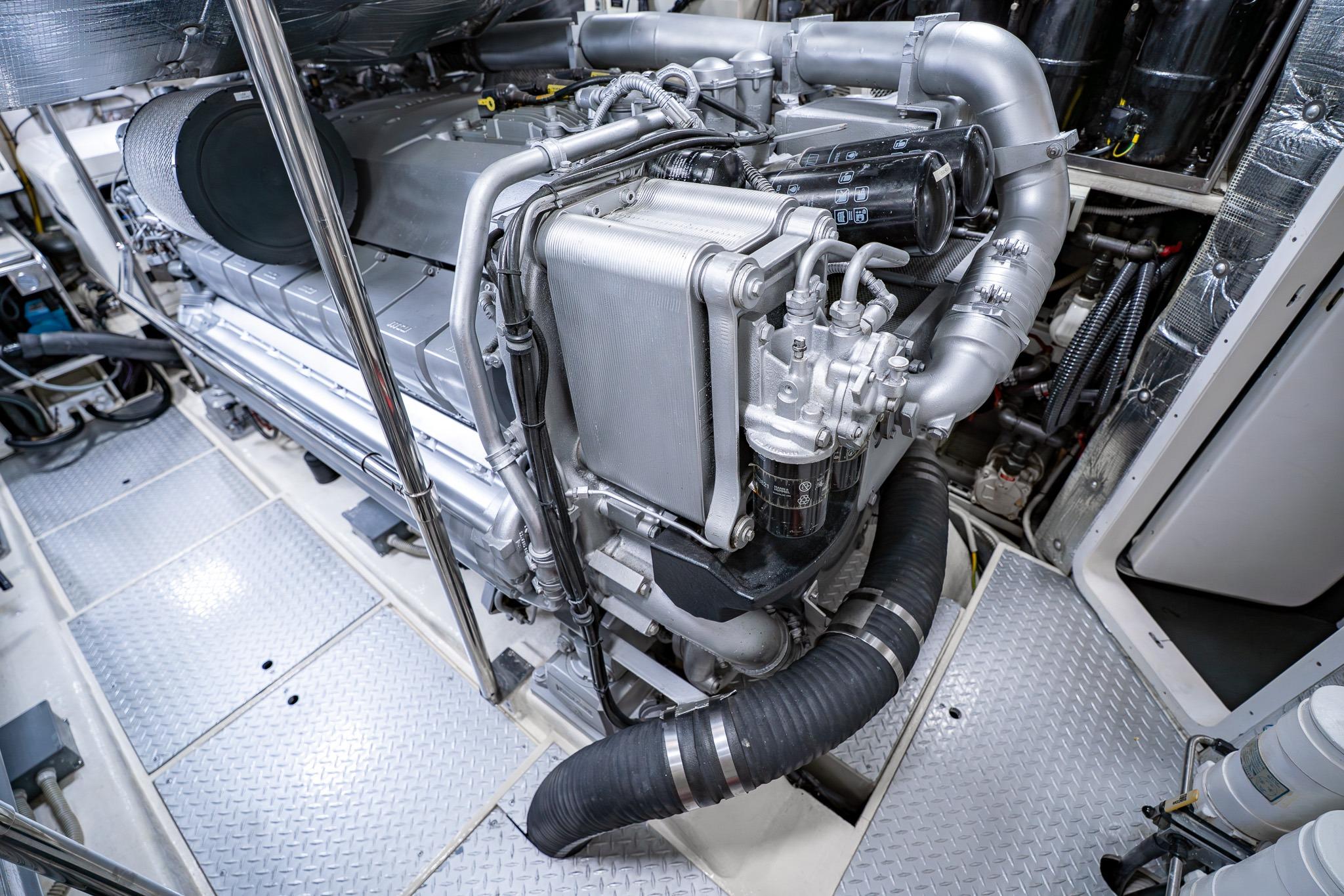Engine room of a 2010 Pershing 80 yacht, showcasing advanced machinery and components.