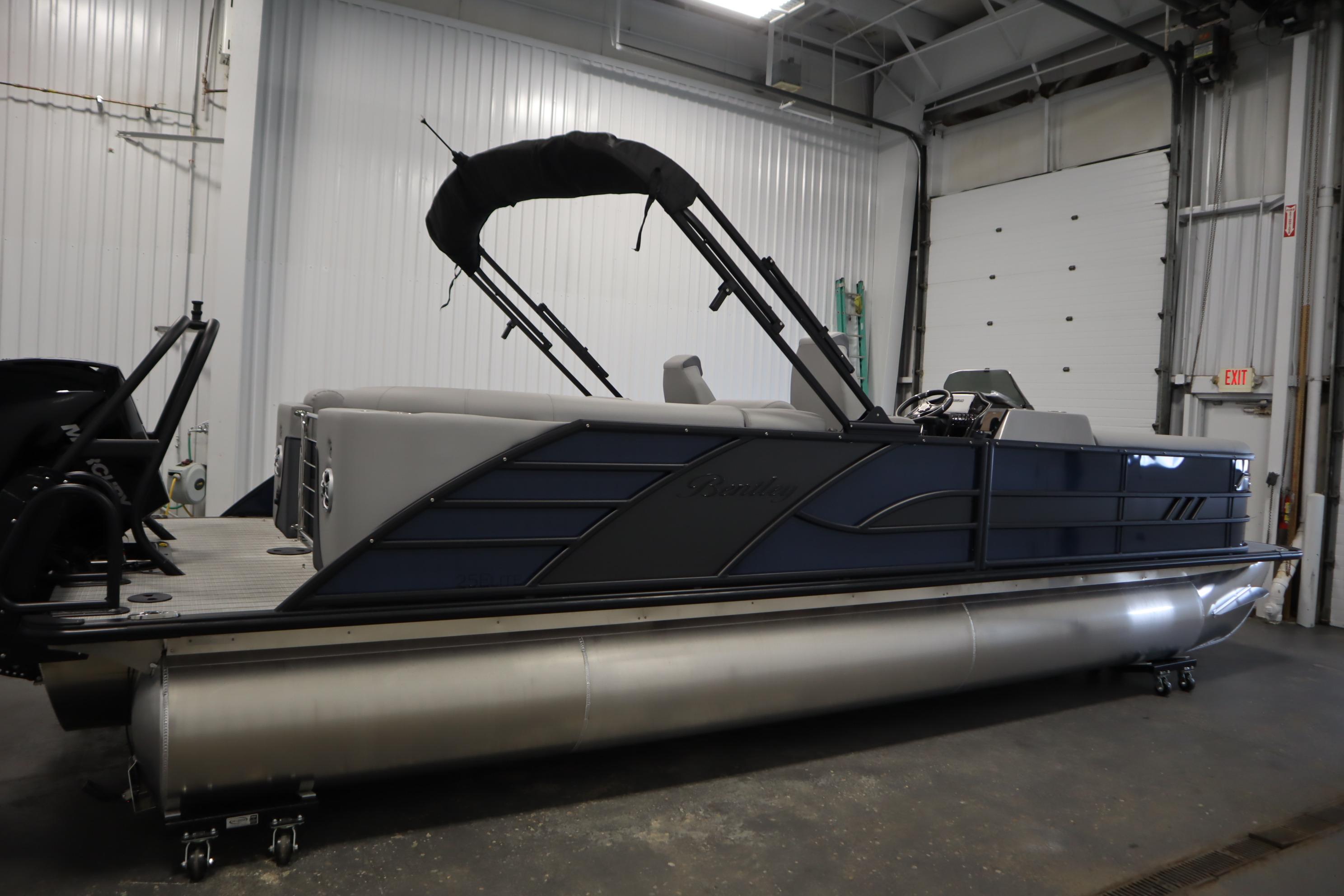 2025 Bentley Pontoons Elite 253 Admiral Tri-toon in a garage setting.