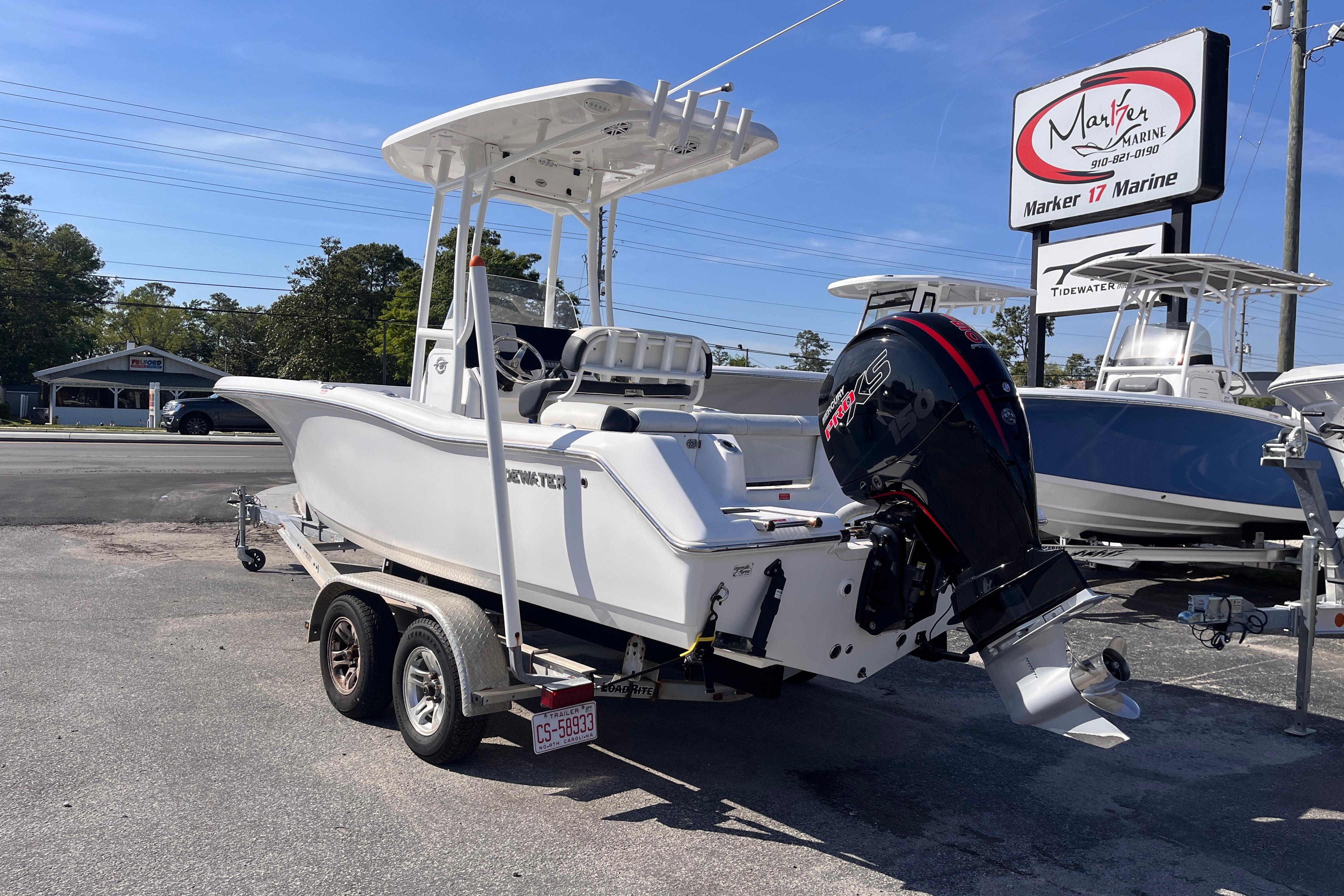 2022 Tidewater 210 LXF boat on trailer at Marker 17 Marine dealership.