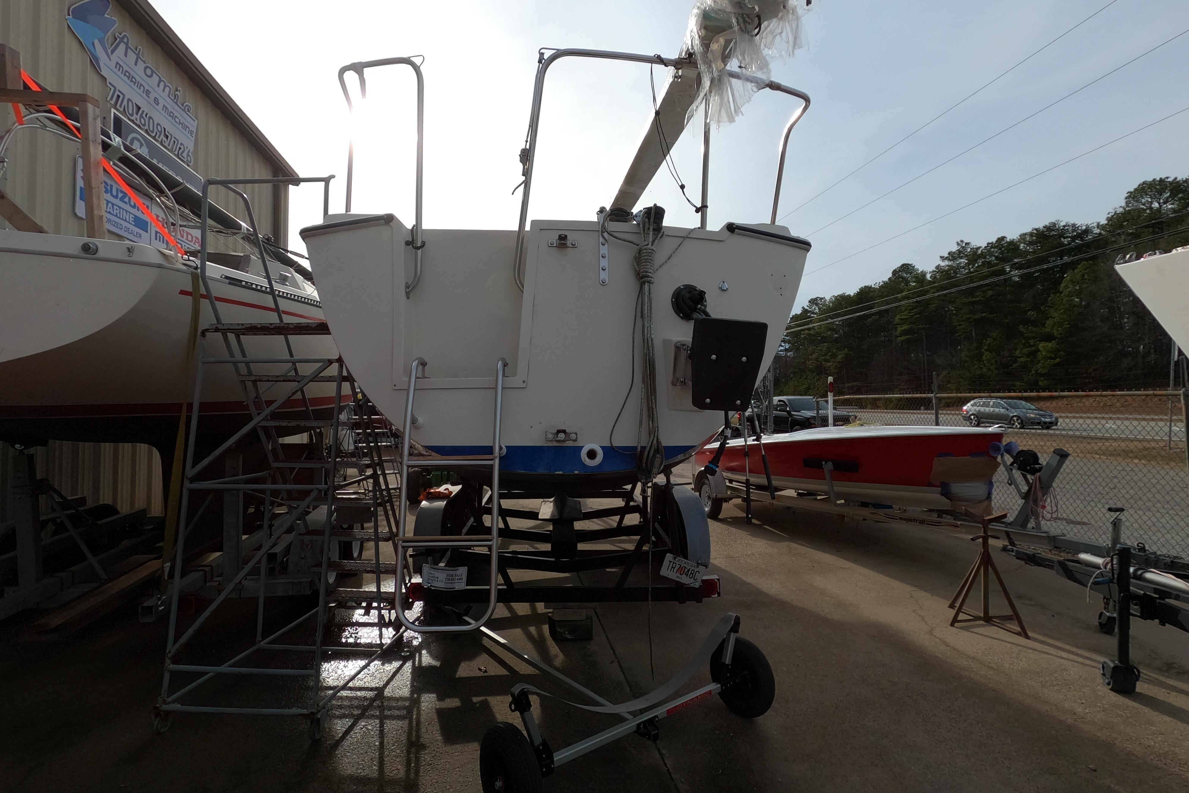 1985 Oday 272 sailboat on trailer, parked outdoors near other boats.