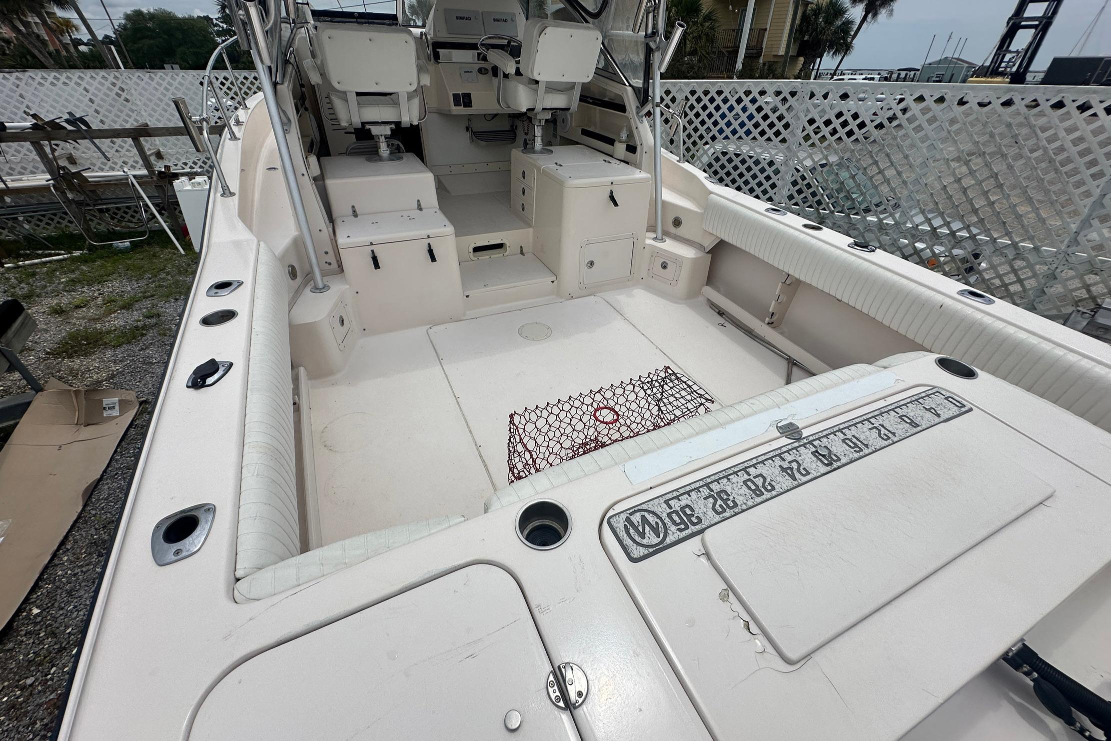 2006 Grady-White Marlin 300 boat interior with seating and fishing equipment.