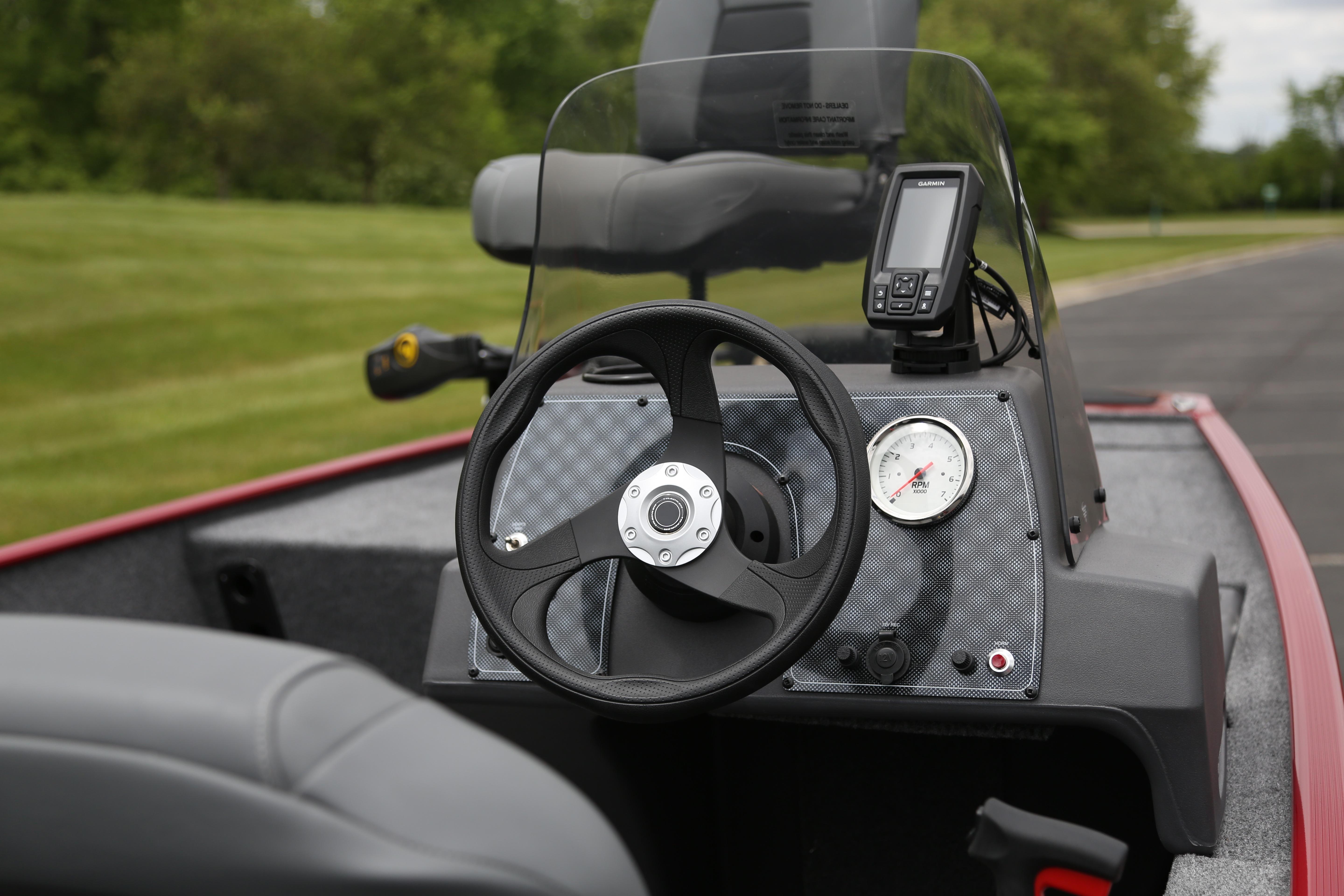 2026 Tracker Bass Tracker Classic XL boat dashboard with steering wheel and navigation display.