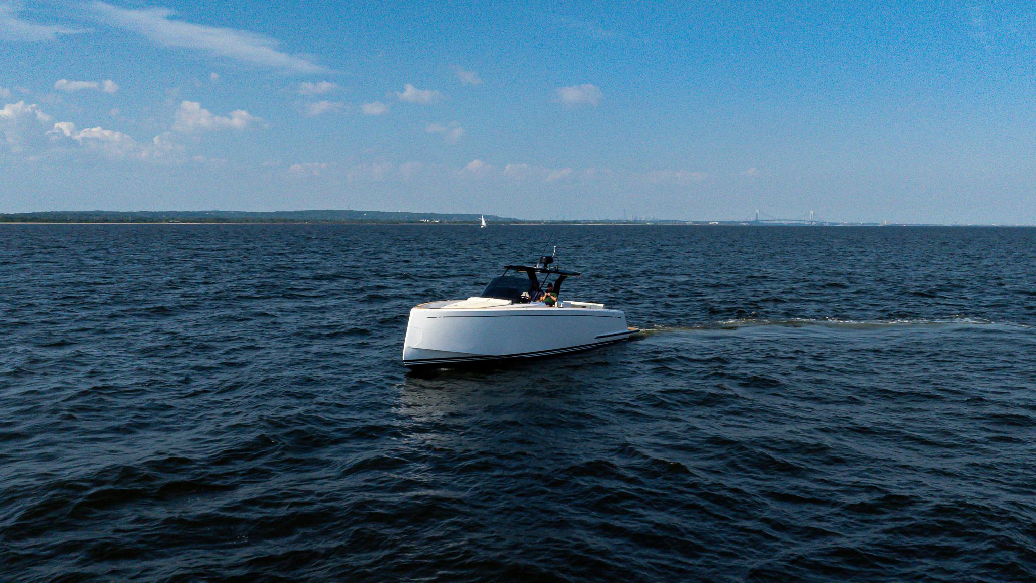 2025 Pardo Yachts 38 Walkaround cruising on open water under a clear blue sky.
