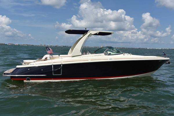 Manufacturer Provided Image: 2019 Chris-Craft Launch 28 GT boat cruising on open water under a blue sky.