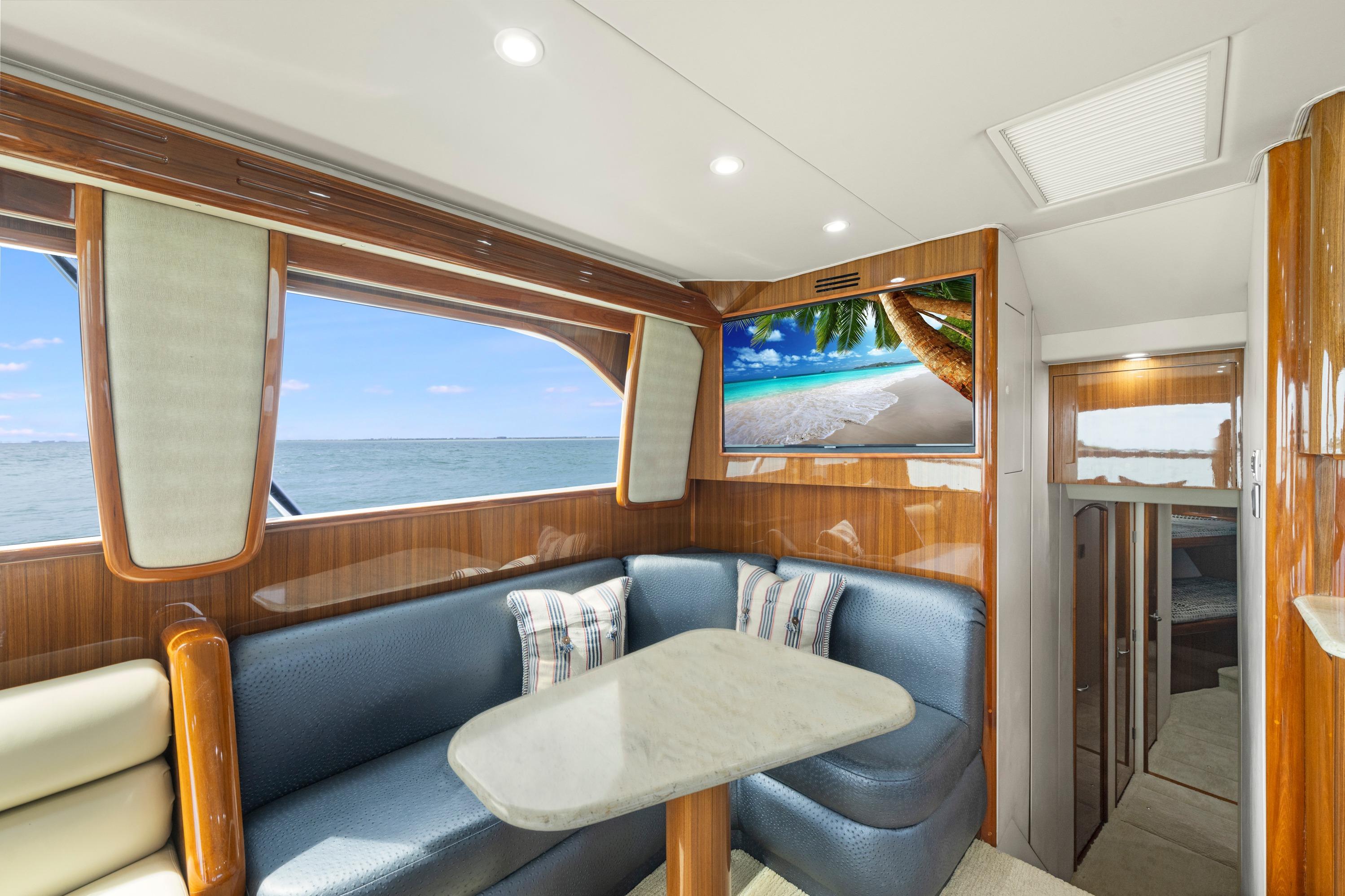 Luxurious interior of 2009 Viking 50 Convertible yacht with ocean view and modern amenities.